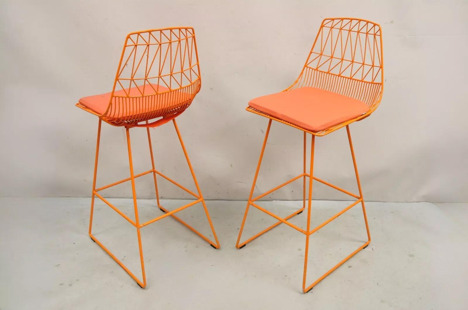 Bend Goods Orange Lucy Stools Wire Metal Frame Barstool from NFL - Set of 4. Circa 21st Century, Pre-owned. Measurements: 44