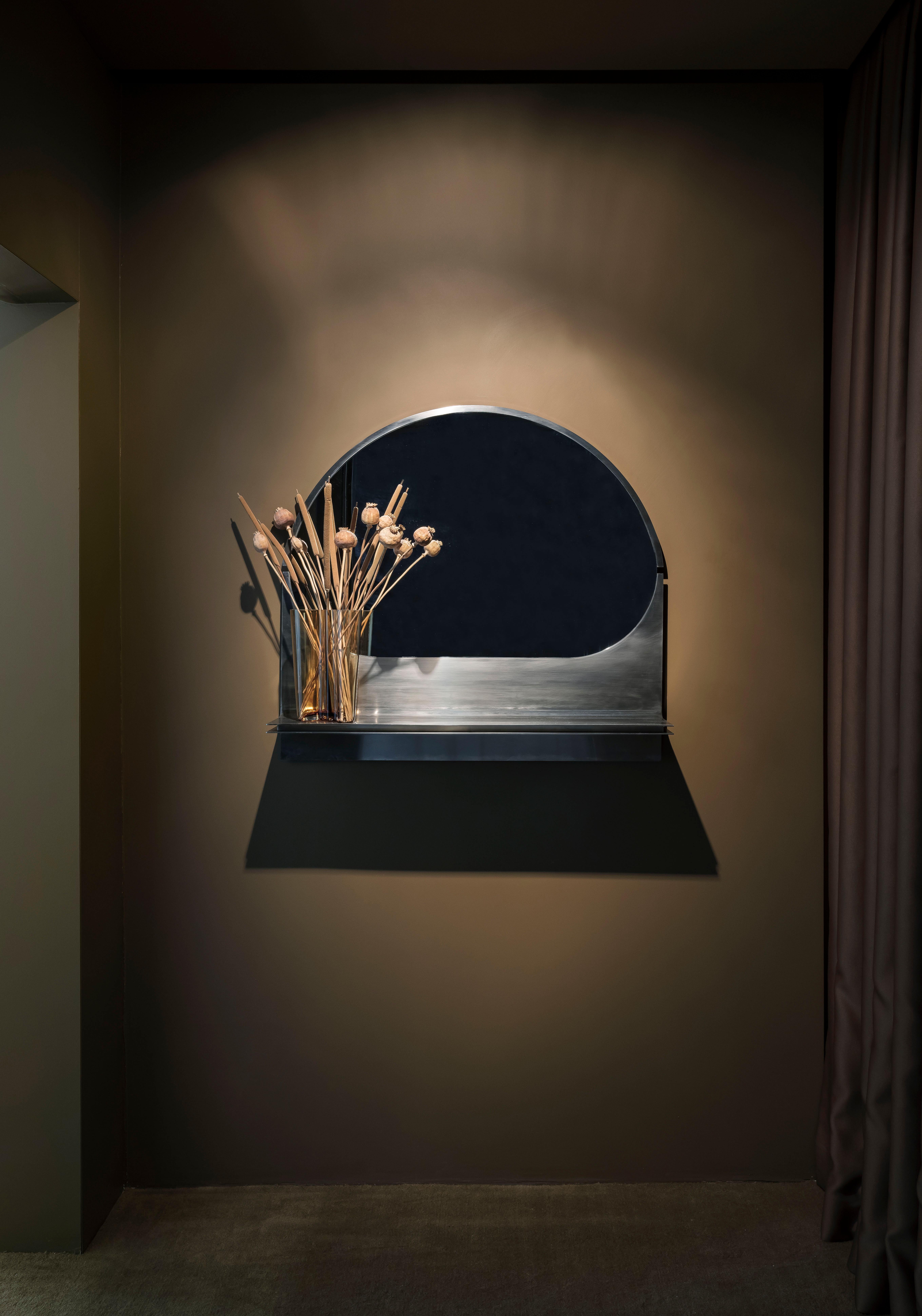 Bend mirror with shelf by Buket Hoscan Bazman
2019
Dimensions: W 90, D 17, H 85 cm
Material: Stainless steel and mirror

Buket Hoscan Bazman was born in Izmir, Turkey, in 1989. Graduated at the Isik University and after few years of working in the