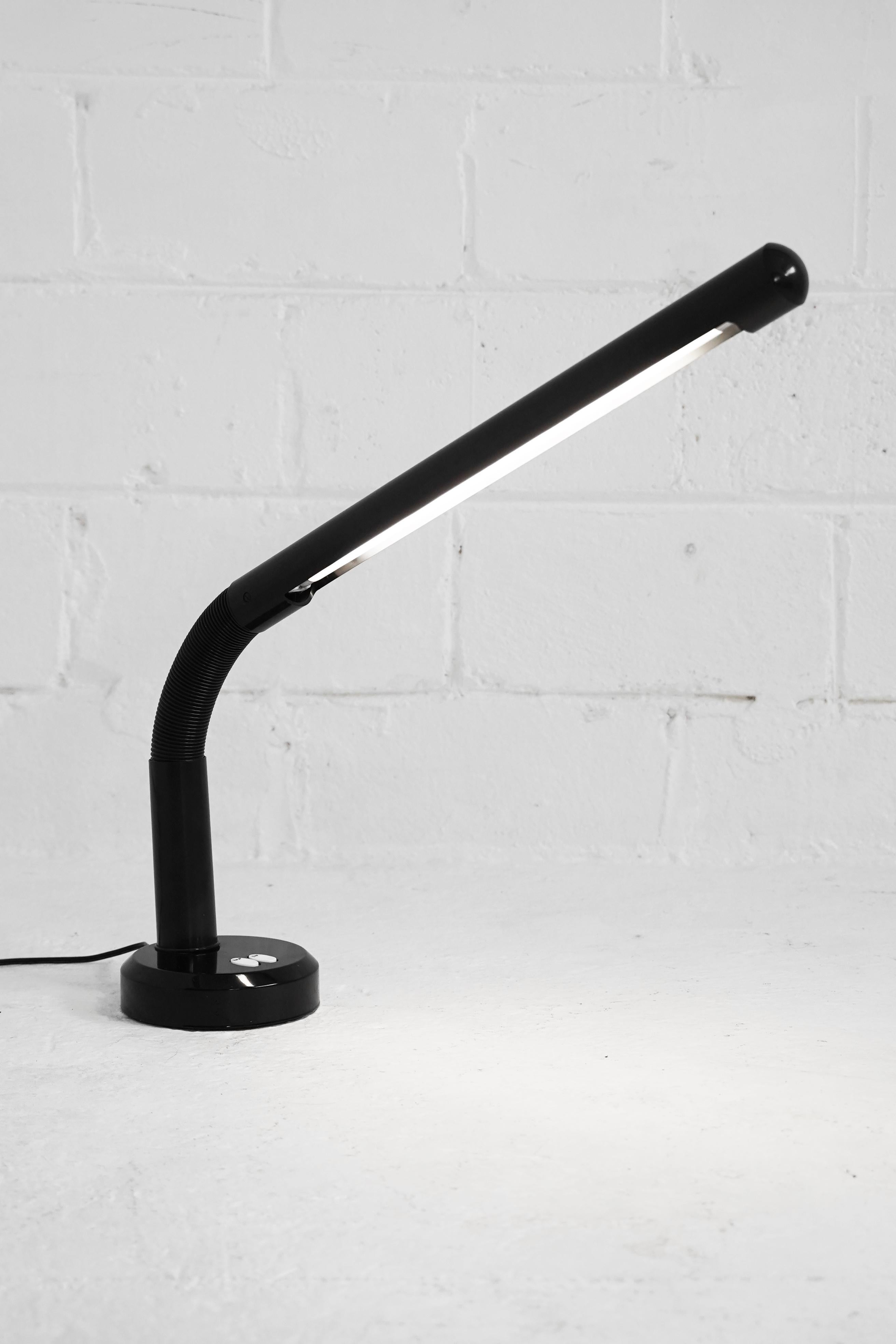 Great vintage adjustable tube lamp in the style of Anders Pehrson in black. A great desk or table lamp, allowing you to configure light in your space.