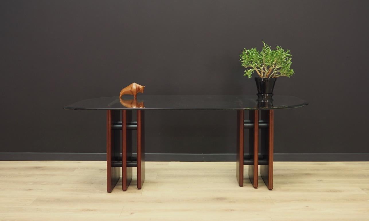 Fantastic table from the 1960s-1970s, Minimalist form. Designed by Bendixen. Tabletop made of glass, construction made of solid mahogany wood. Maintained in good condition (minor bruises and scratches), directly for use.

Dimensions: Height 51 cm,