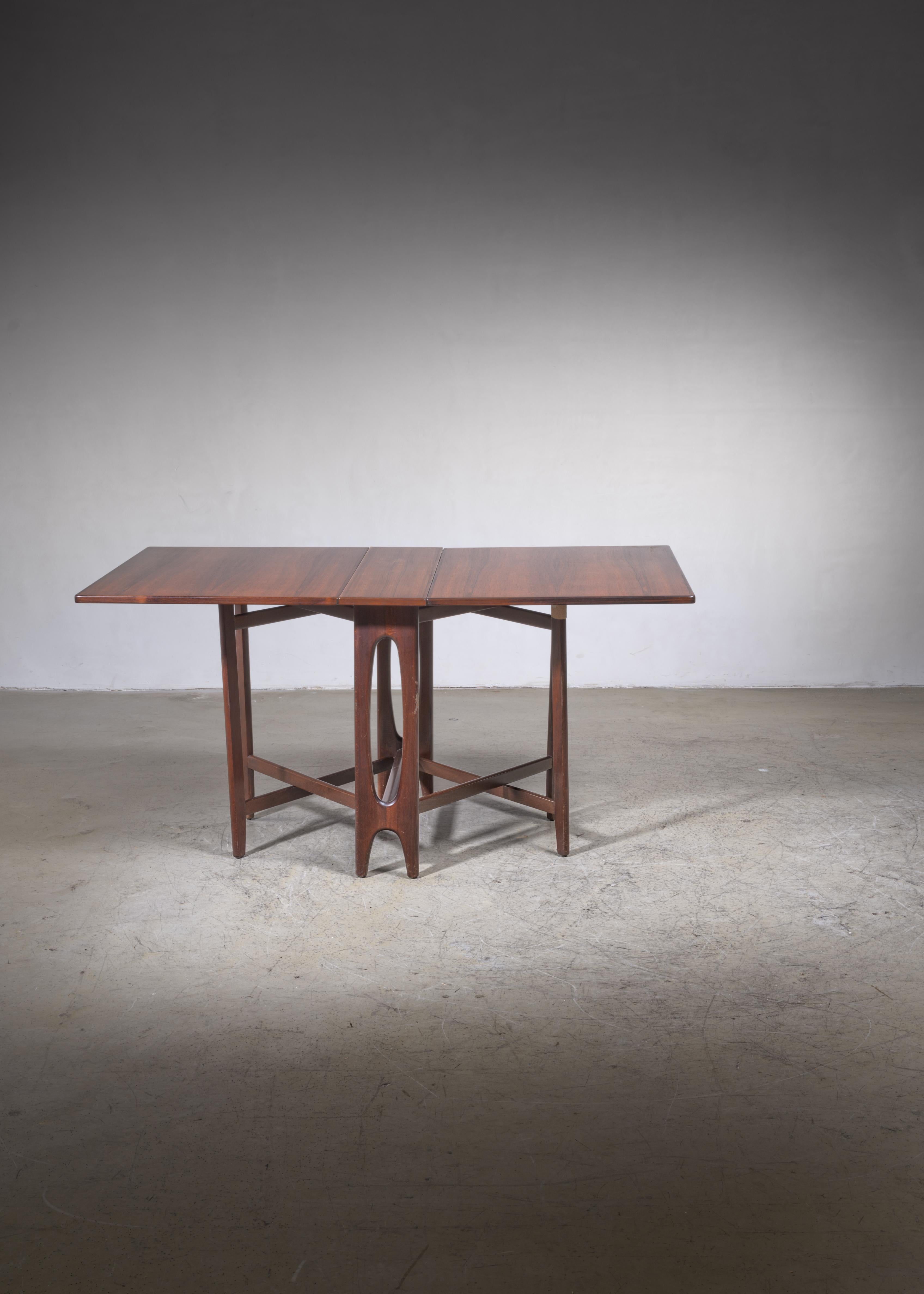 A Scandinavian drop-leaf gateleg dining table by Bendt Winge.
 