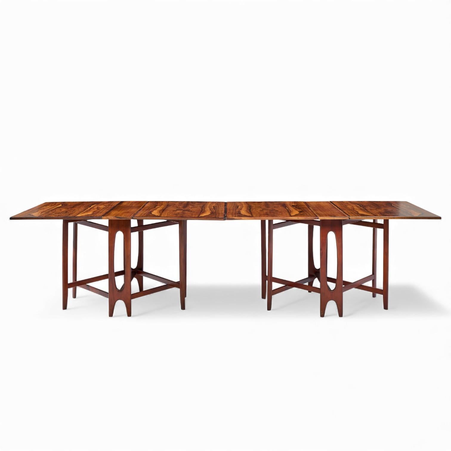 Bendt Winge Mid Century Norwegian Rosewood Drop-Leaf Rosewood Dining Table - Pair

Each table measures: 8.25 wide x 34.75 deep x 28.75 inches high, with a chair clearance of 28 inches, the width with both drop leaves engaged is 59 inches

Restored -