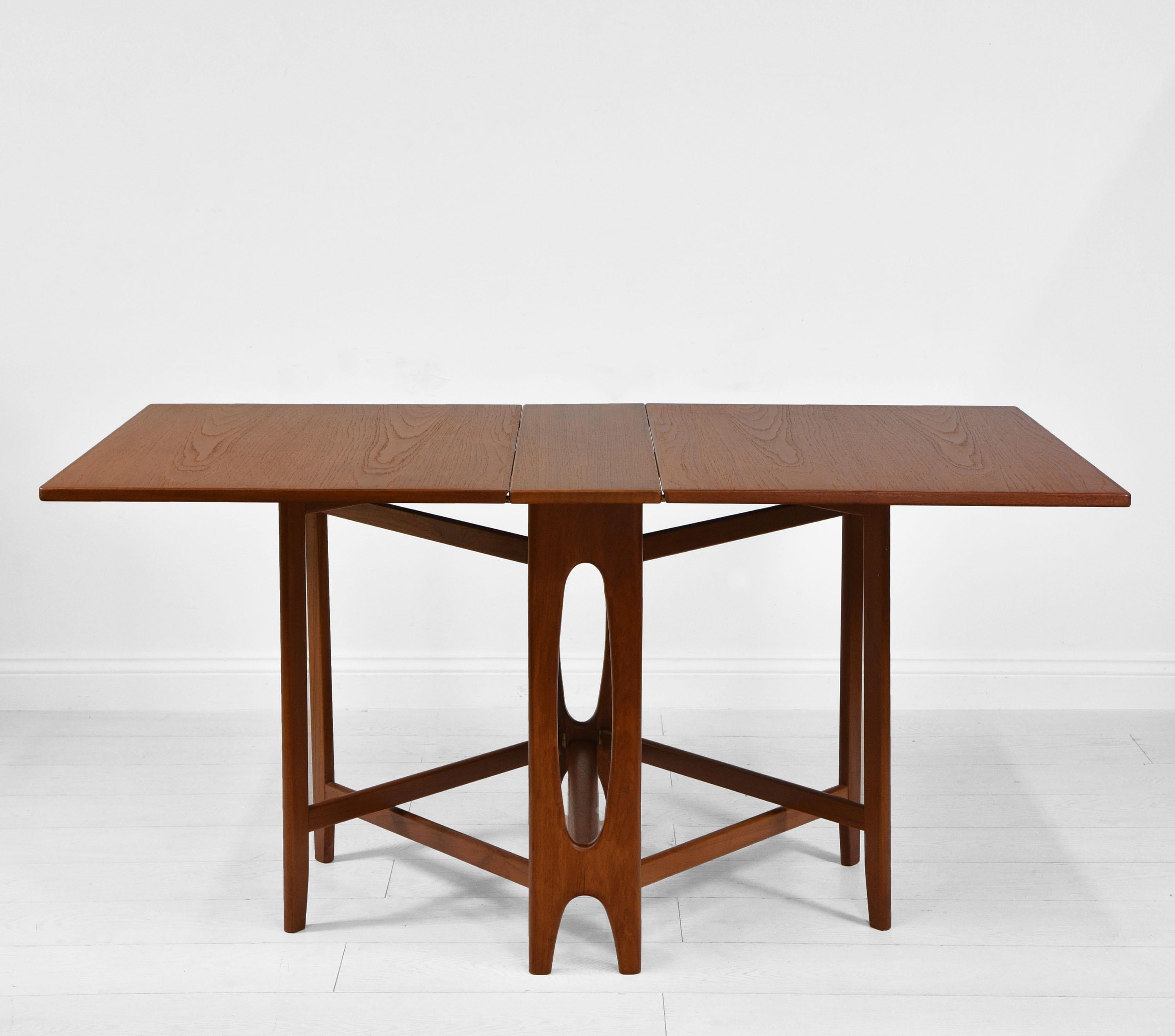 A mid-century teak drop leaf dining table designed by Bendt Winge by Kleppe Møbelfabrikk. Norwegian. Circa 1950's.

This space saving design was known as the 'flap table number 2'. 

Bendt Winge was one of the first professional interior