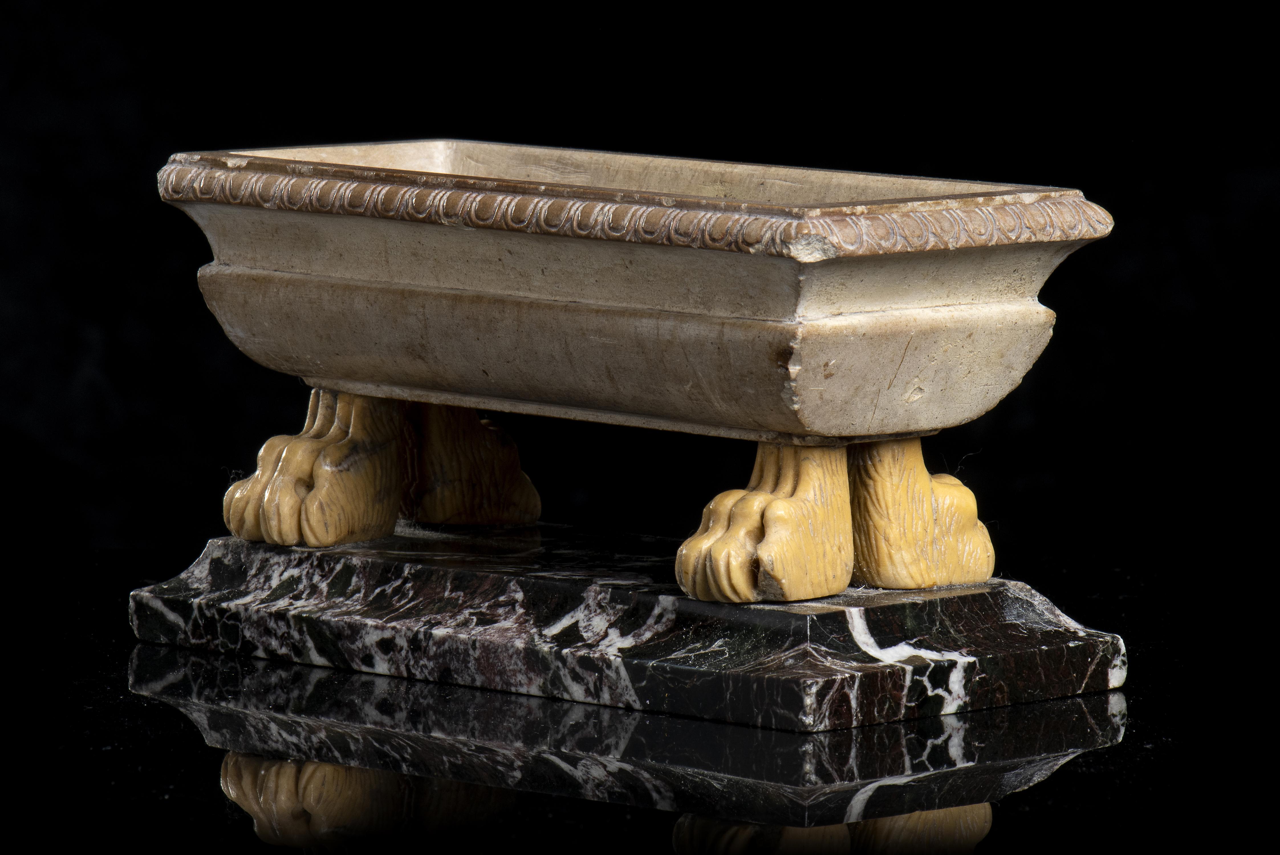 A Giallo Antico (Giallo Numidia ) marble grand tour model of a bath with ferine feet standing on a squared Violet Marble two order base. The work from the workshop of Benedetto Boschetti is a typical example of grand tour production of the 19th