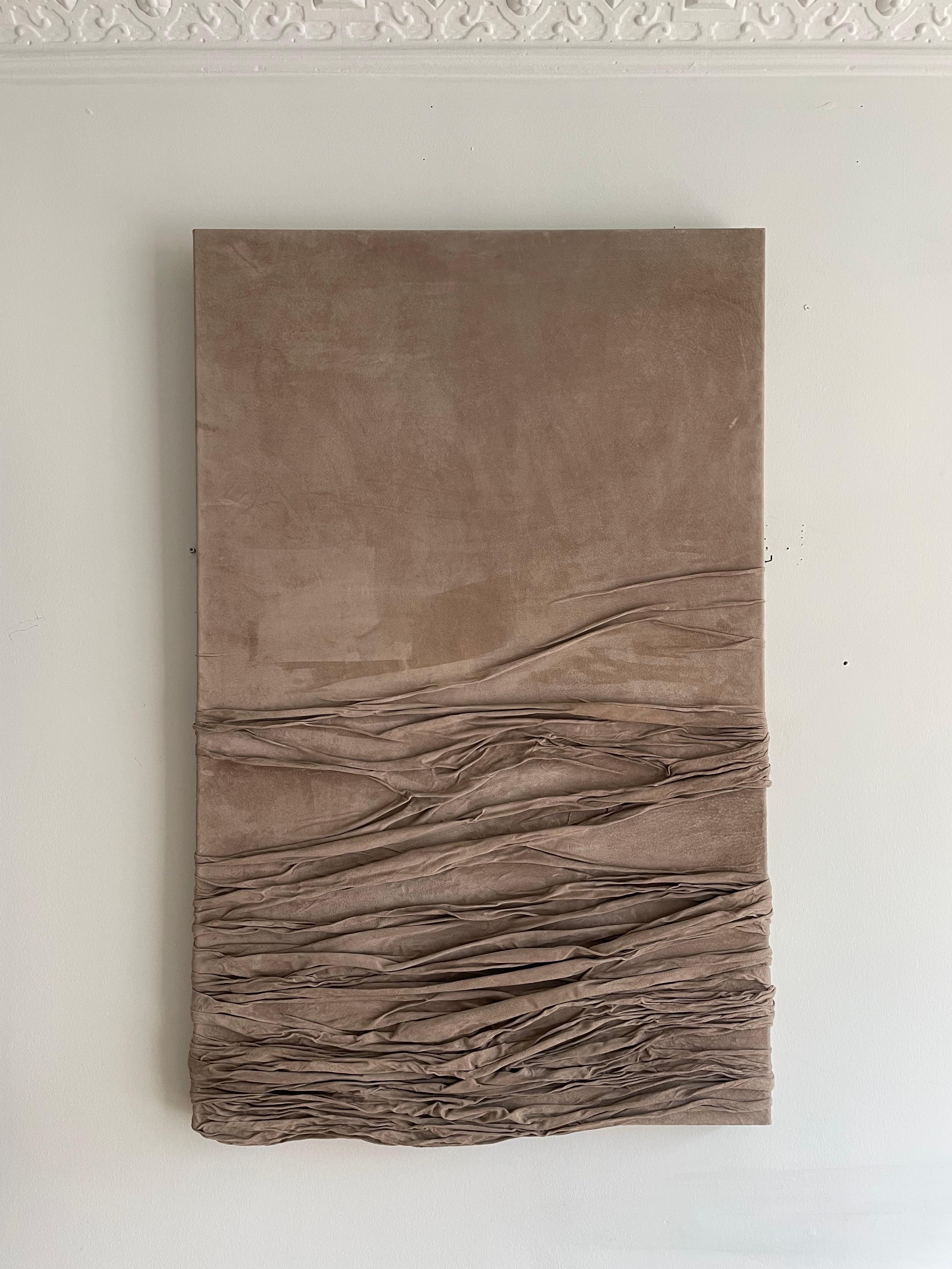 This elegant and contemporary relief artwork is crafted by Danish artist Benedicte Maria Bech Pedersen (1988-), known for her unique approach to leather as a medium. The large feminine relief is made of a one-piece suede leather, which is