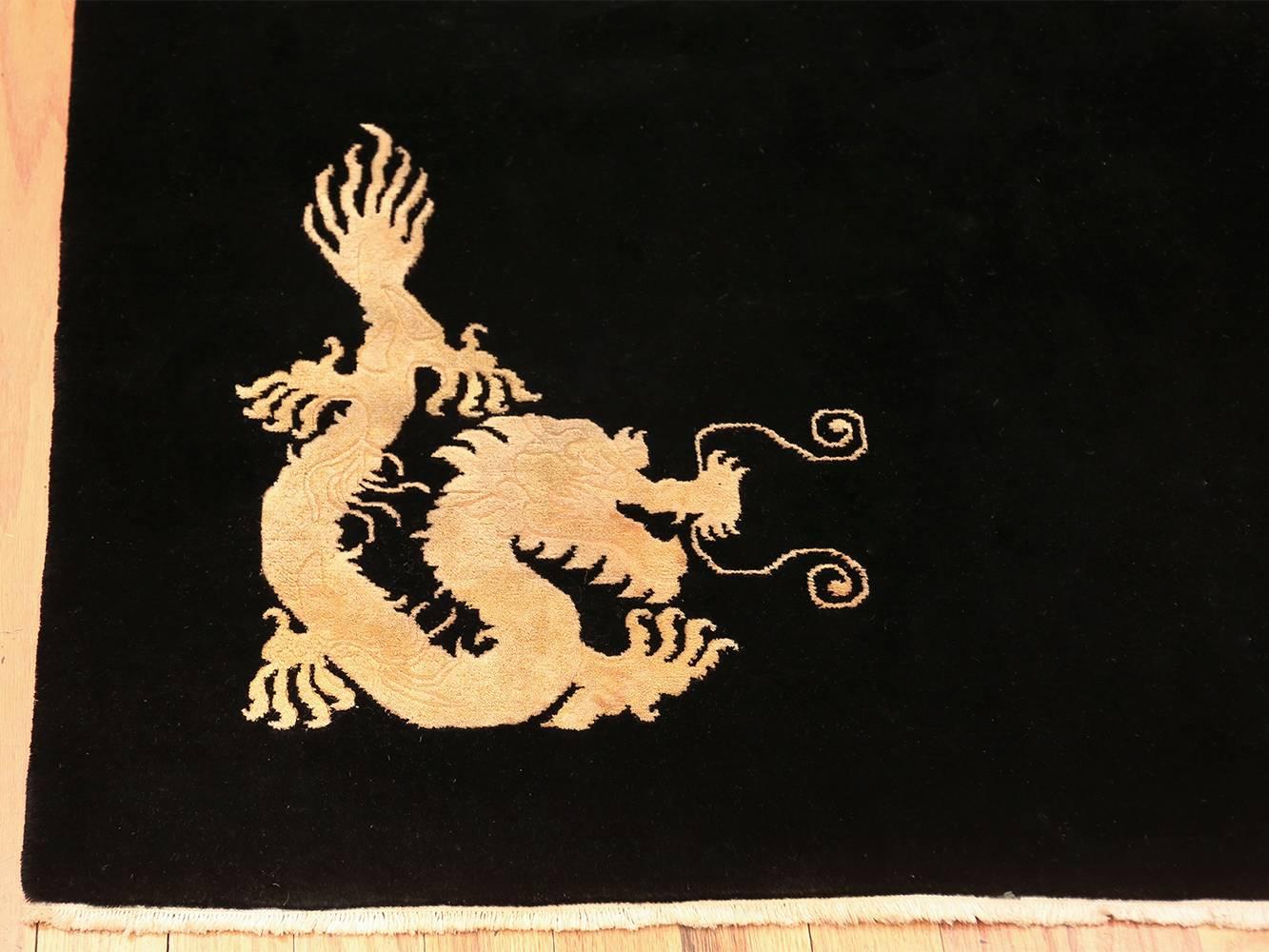 Benevolent Five Clawed Dragon Design Black Antique Chinese Rug. Size: 7' x 9' 6