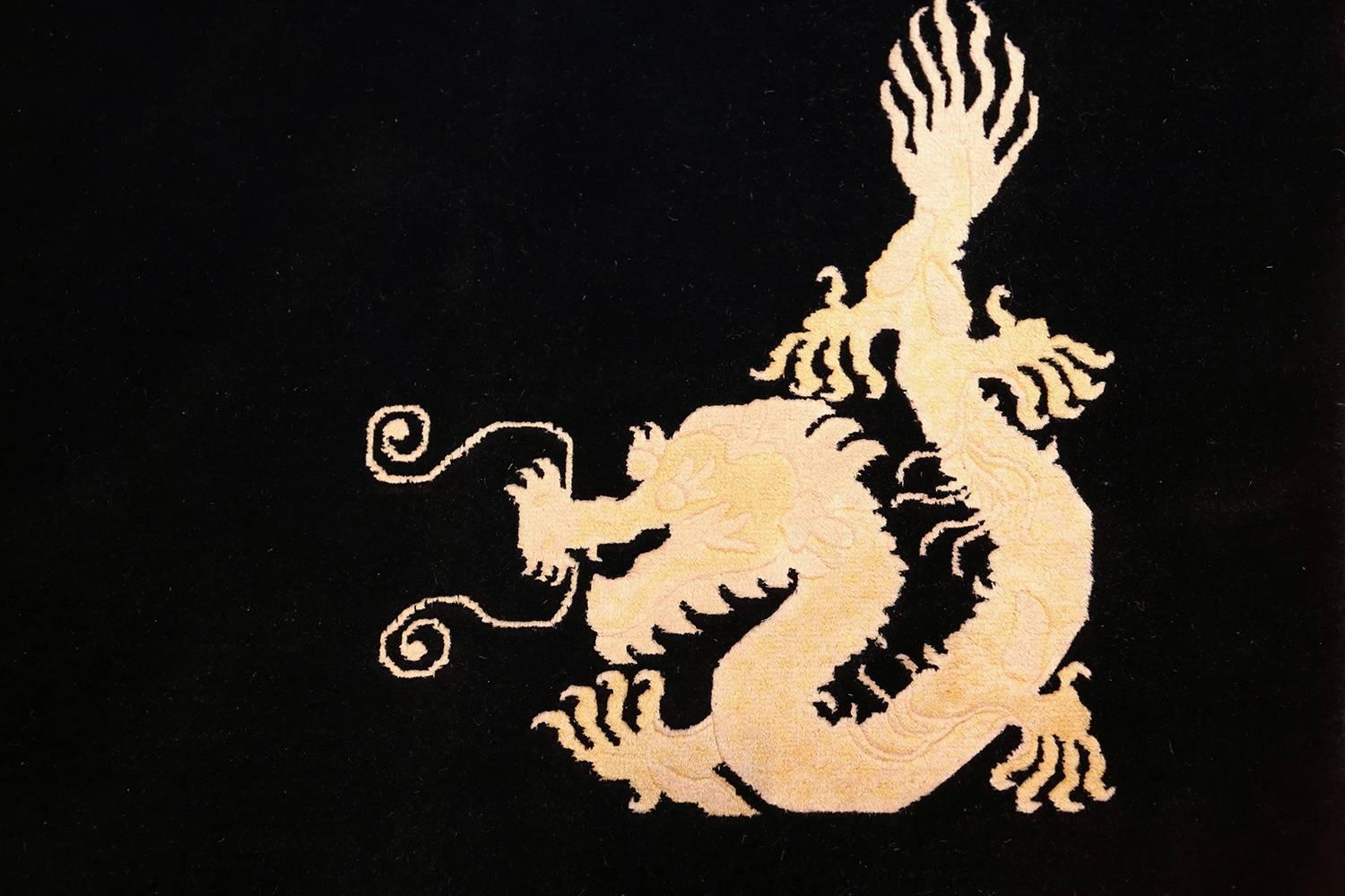 20th Century Benevolent Five Clawed Dragon Design Black Antique Chinese Rug. Size: 7' x 9' 6