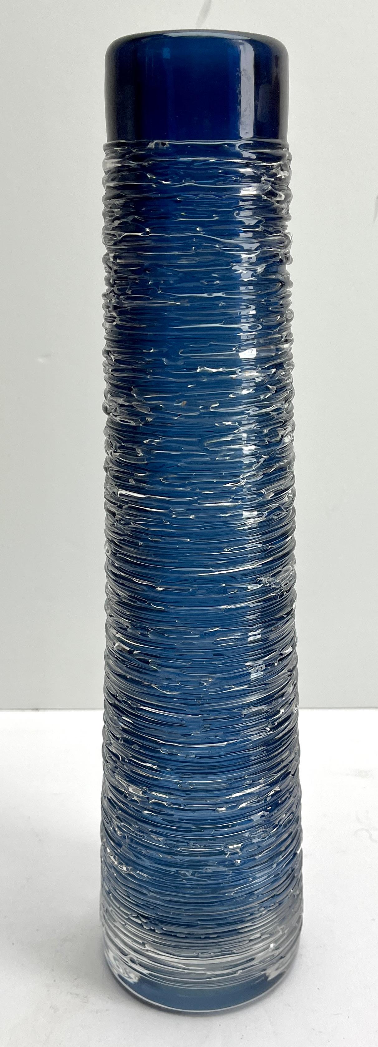BENGT EDENFALK textured Glass Vase SKRUF Sweden 
Beautiful heavy ice blue vase, covered with clear glass, wrapped with clear threads.
Designed by Edenfalk for Skruf.  SIGNED

Height 33 cm.
Weight  1.9 Kg
Signed Edenfalk, Skruf!
