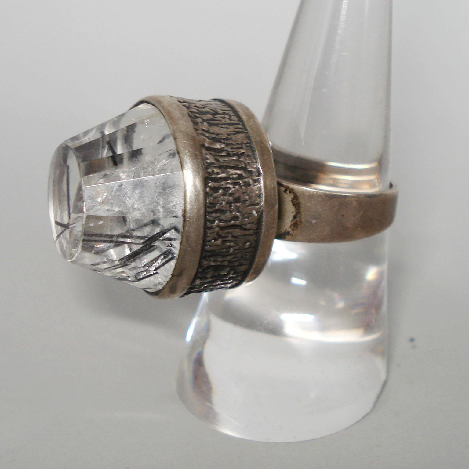 Bengt Hallberg Silver Ring with Rock Crystal, Mid-Century, Sweden, 1969.
A big Mid-Century Modern silver and rock crystal ring, by Bengt Hallberg, Sweden, 1969.
Marks: Bengt Hallberg makers mark, town mark from Köping, the Three Crowns of the