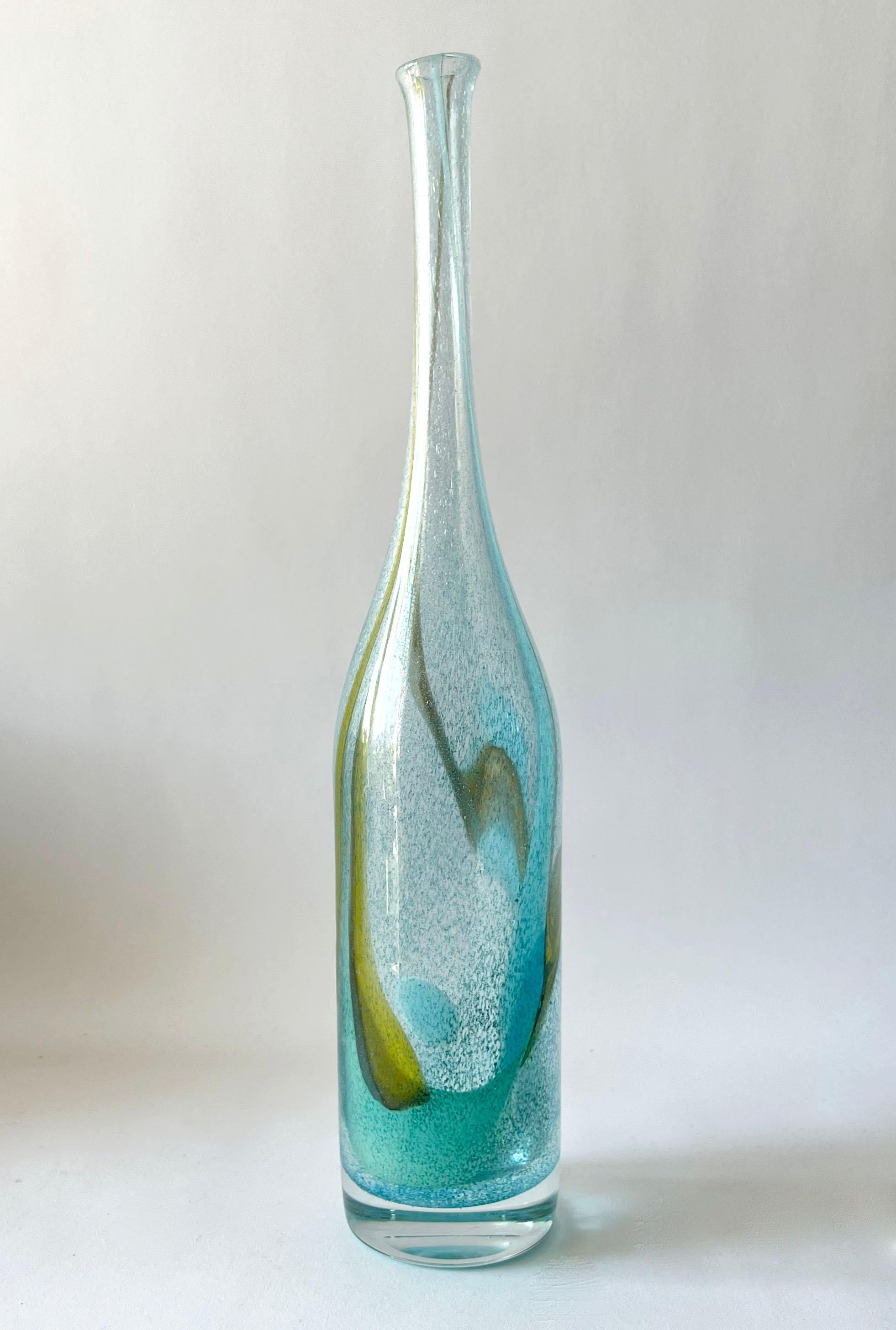 Hand blown glass bottle vase created by Bengt Orup for Johansfors, Sweden, circa 1960s. Piece measures 16