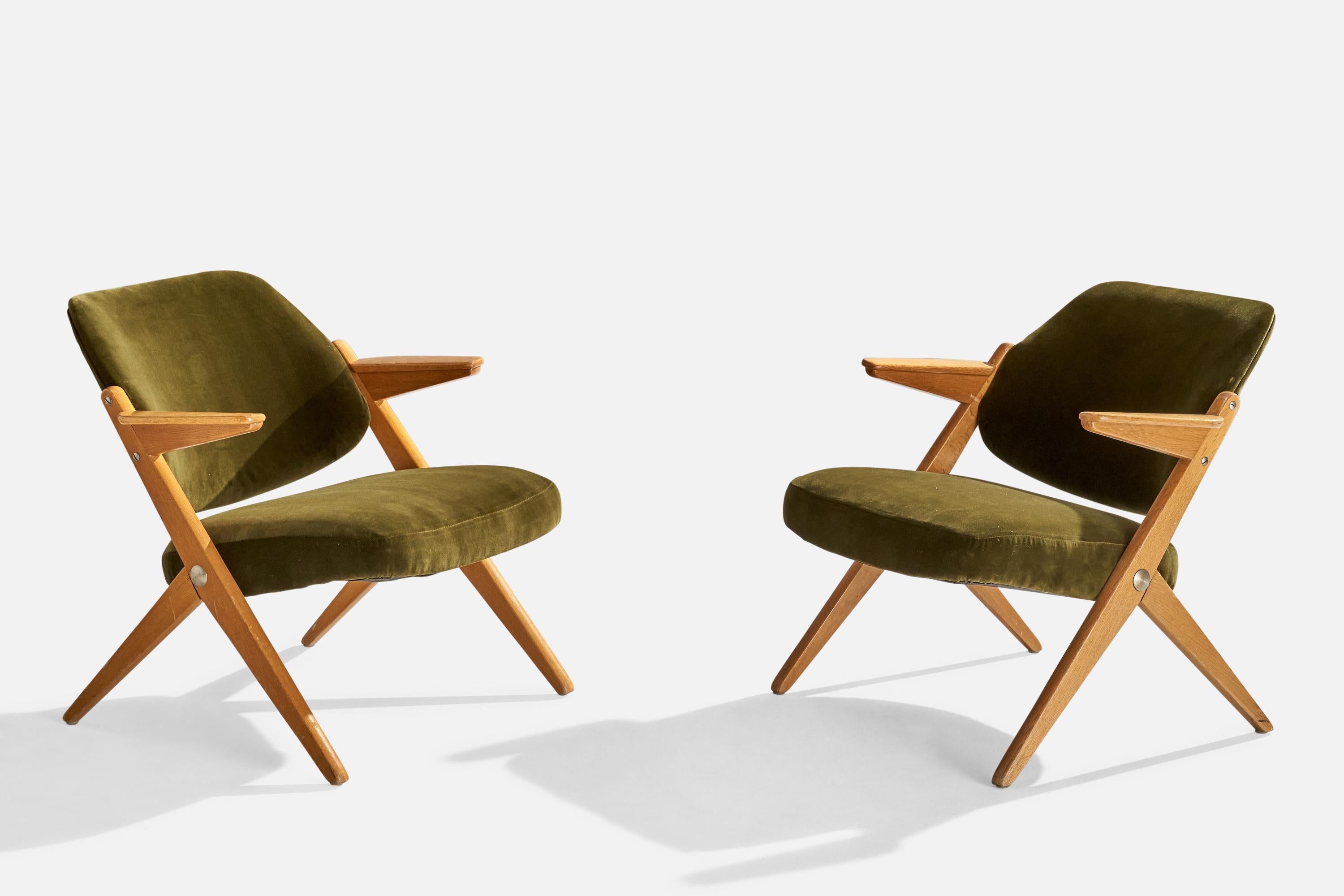 A pair of teak and green velvet lounge chairs designed by Bengt Ruda and produced by Nordiska Kompaniet, Sweden, c. 1950s.

Seat Height: 15.5

All upholstered furniture can be reupholstered upon request for an additional fee. Lead times will be an