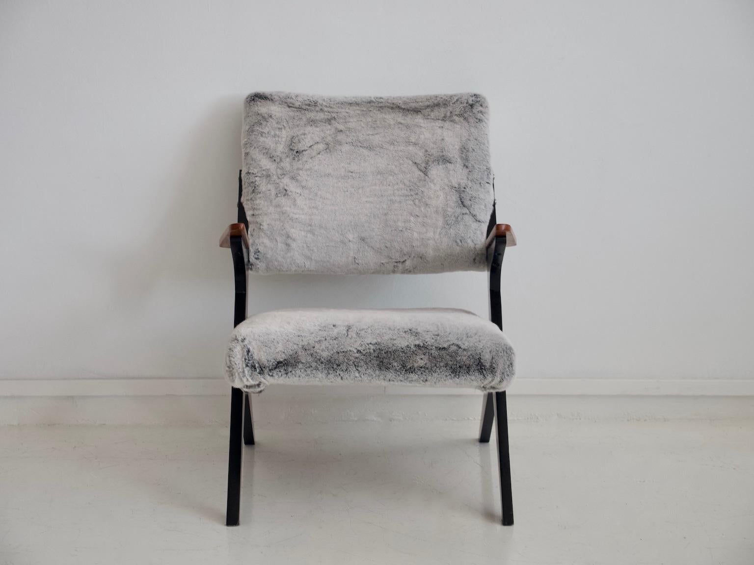 Armchair designed in the 1950s by Bengt Ruda for Nordiska. Frame of ebonised wood and teak, later grey faux fur upholstery. Similar in the style of armchairs by Jose Zanine Caldas.