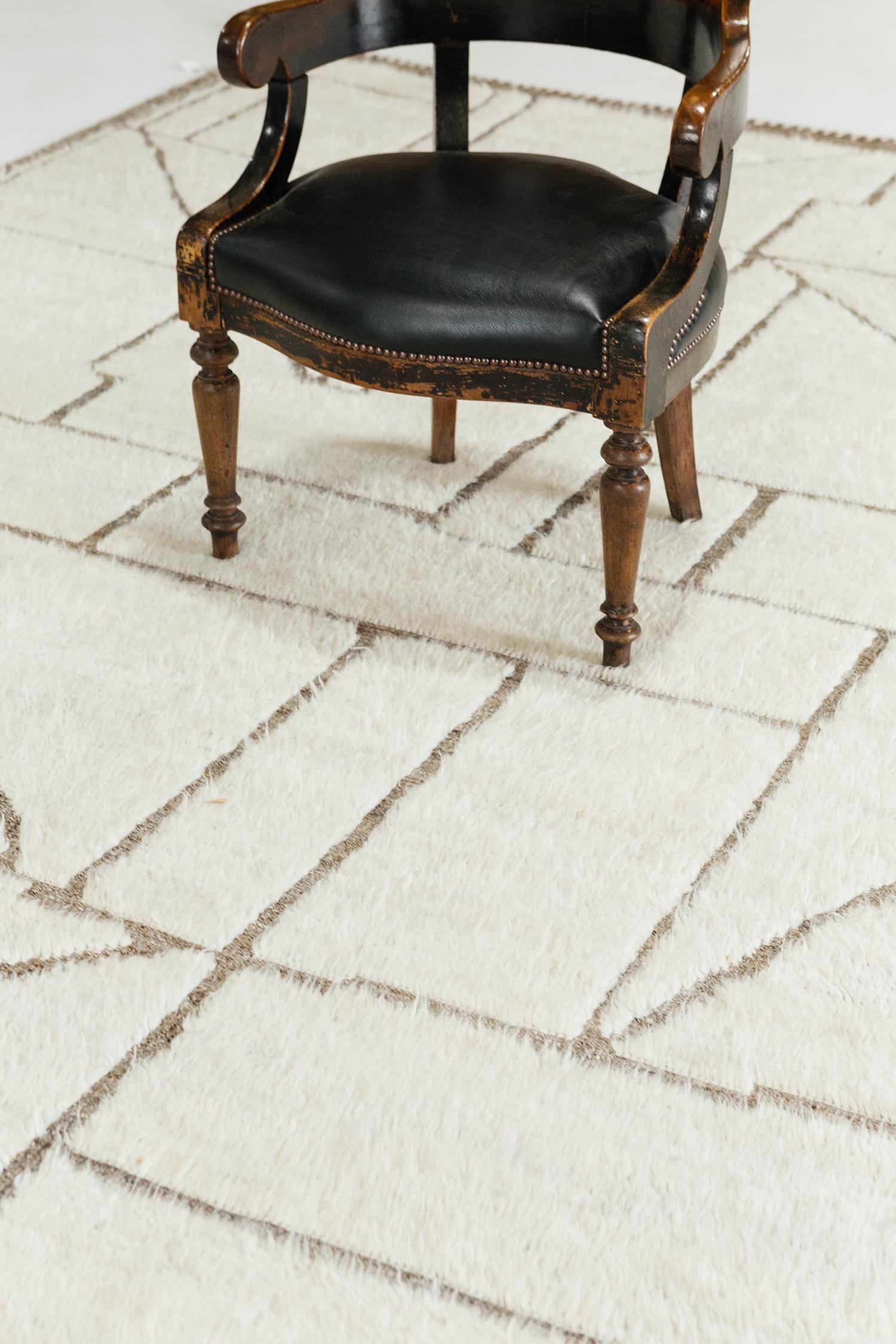 'Benhaddou' is a beautiful textured rug with embossed detailing into an overall geometric and contemporary design. Line work moving irregularly brings movement and are inspired by the Atlas Mountains in Morocco for the modern design world. The rug's