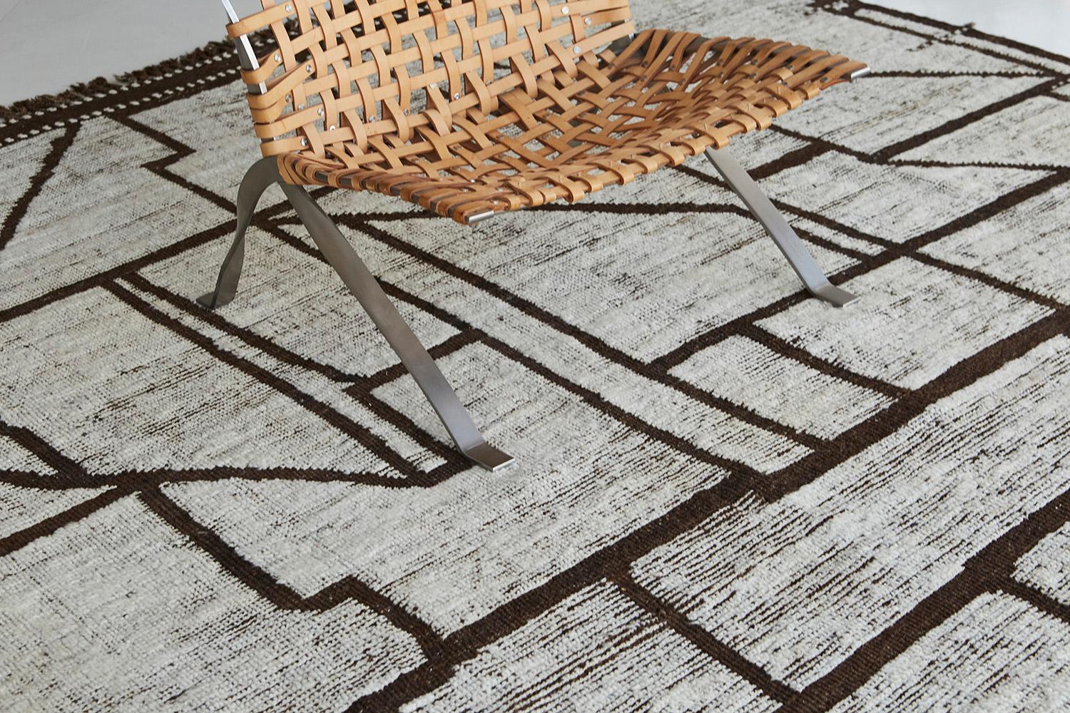 Benhaddou' is a beautifully textured rug with embossed detailing into an overall geometric and contemporary design. Linework moving irregularly brings movement and is inspired by the Atlas Mountains in Morocco for the modern design world. The rug's