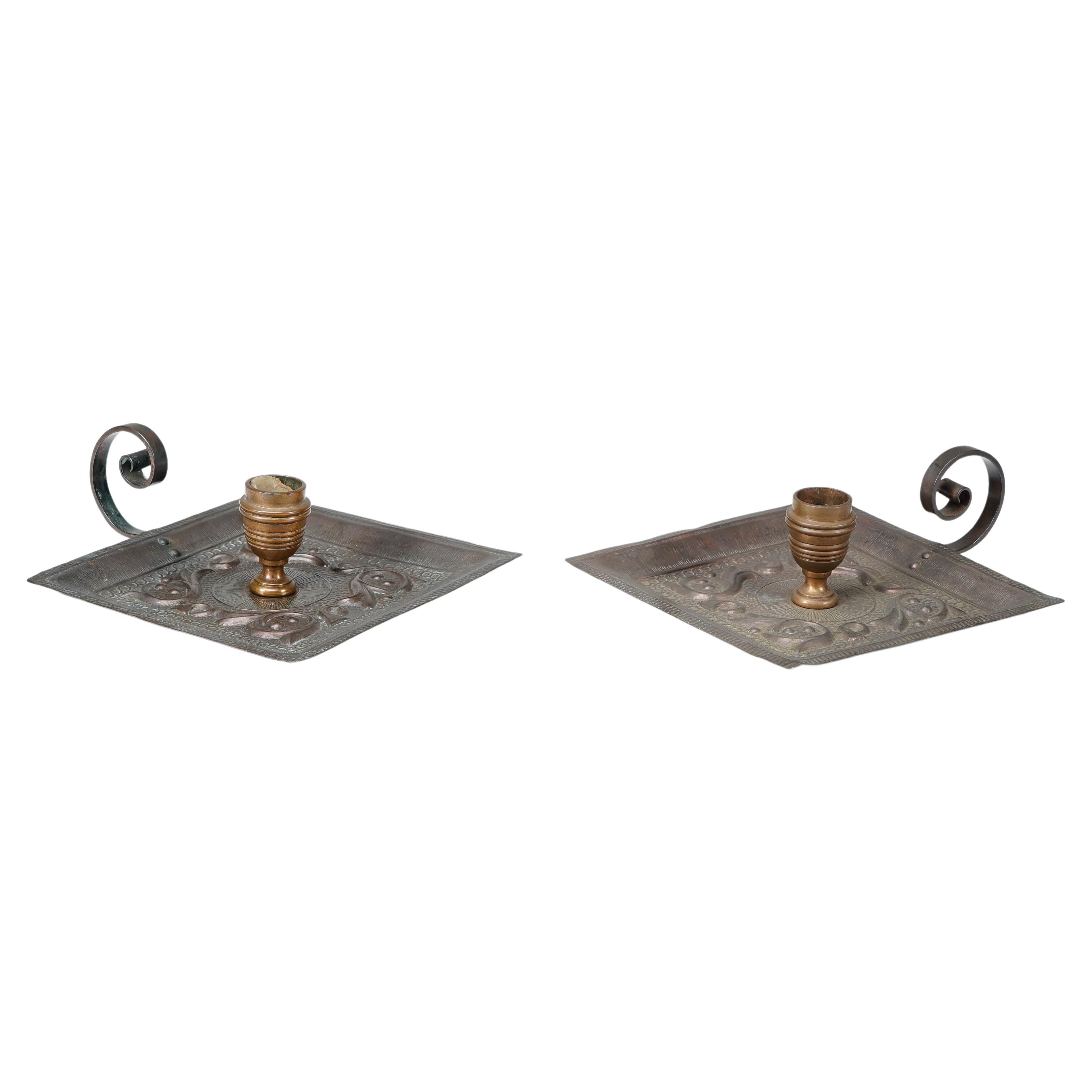 Benham and Froud London. A pair of Arts and Crafts copper night candle holders
