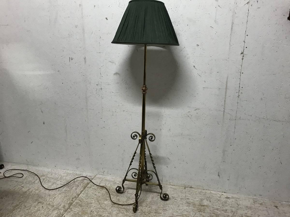Benham & Froud. An Arts & Crafts copper and brass telescopic electric standard lamp with twisted and scroll work details to the base and a later handmade green pleated silk shade.