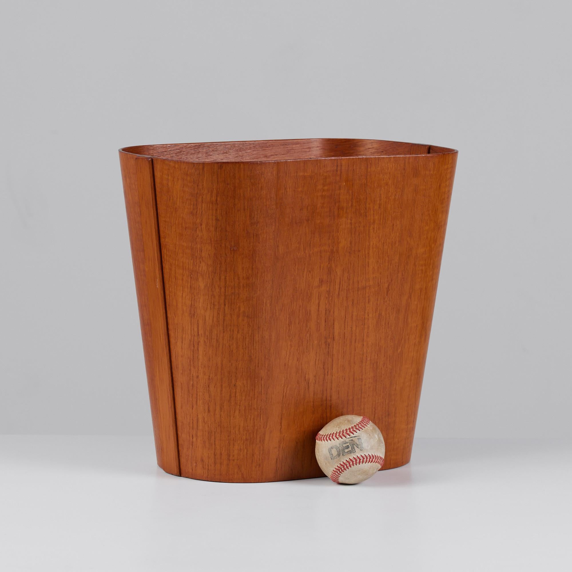 Teak wastebasket by Beni Mobler, c.1960s, Denmark. This bin features a thin rectangular teak plywood body joined together by solid teak strips at each side.

Dimensions: ?14