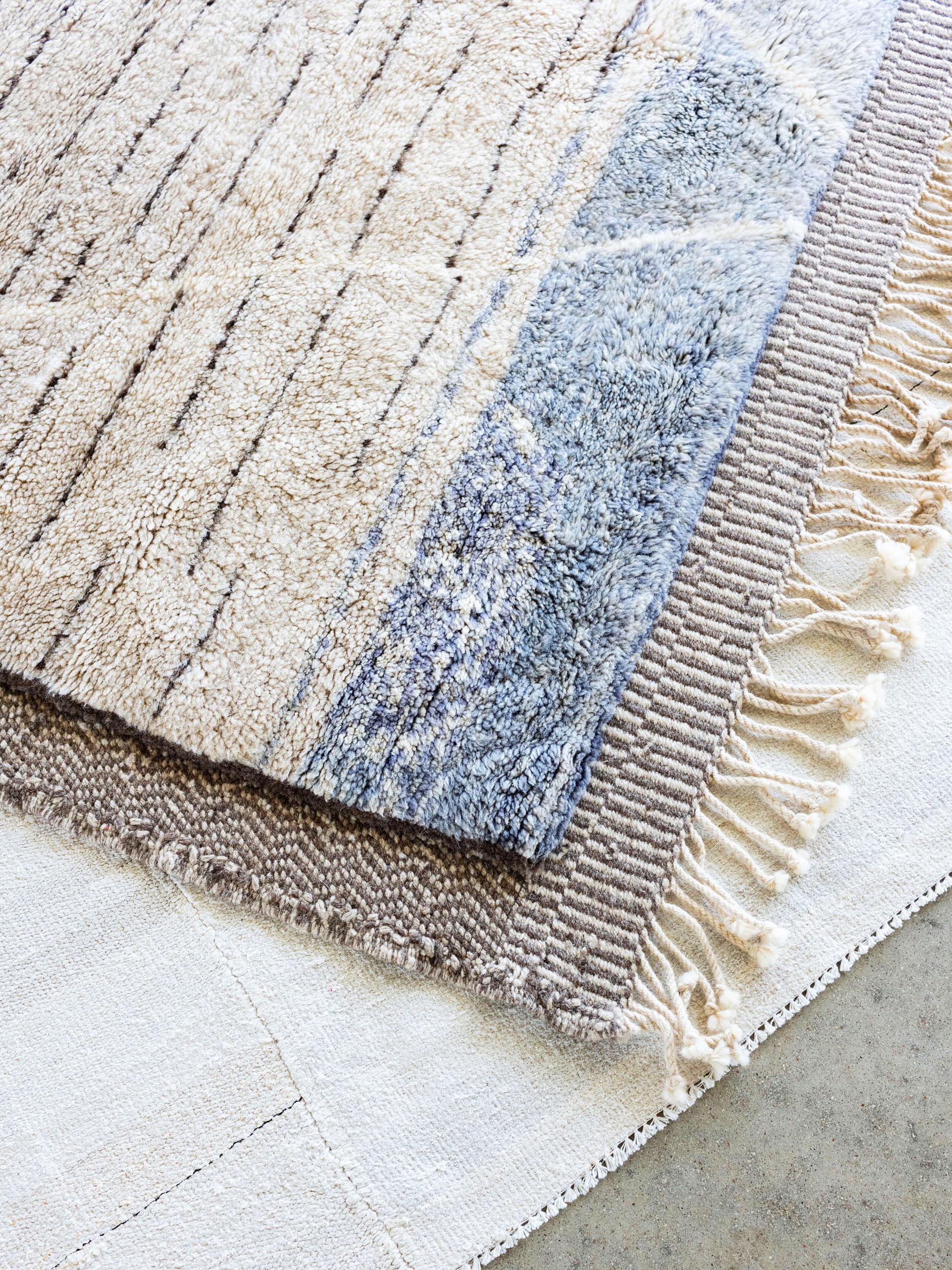 A one-of-a-kind plush rug made of the finest sheep’s wool from New Zealand, hand woven by the women of the Beni M’rirt tribe of Morocco. A pure and extra-virgin material, New Zealand wool is considered the pinnacle in quality, offering unparalleled