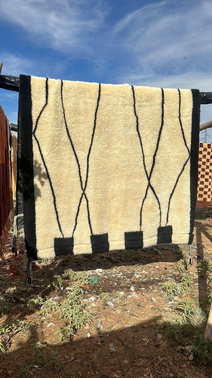 Contemporary Moroccan Beni Mrirt rug handwoven in an abstract tribal Berber design. 

Dimensions: 7'2 x 12'3  

