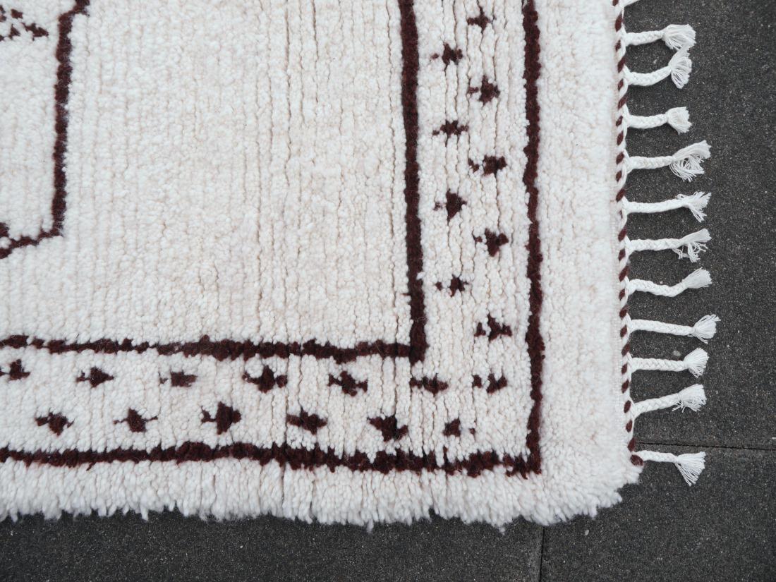 A Lion Berber rug from Morocco 

This rug was hand knotted by women of the Beni Ourain tribe in the Atlas Mountains of Morocco. It has wonderful soft wool and medium high pile. It is new, unused and in excellent condition.

For many tribal people in