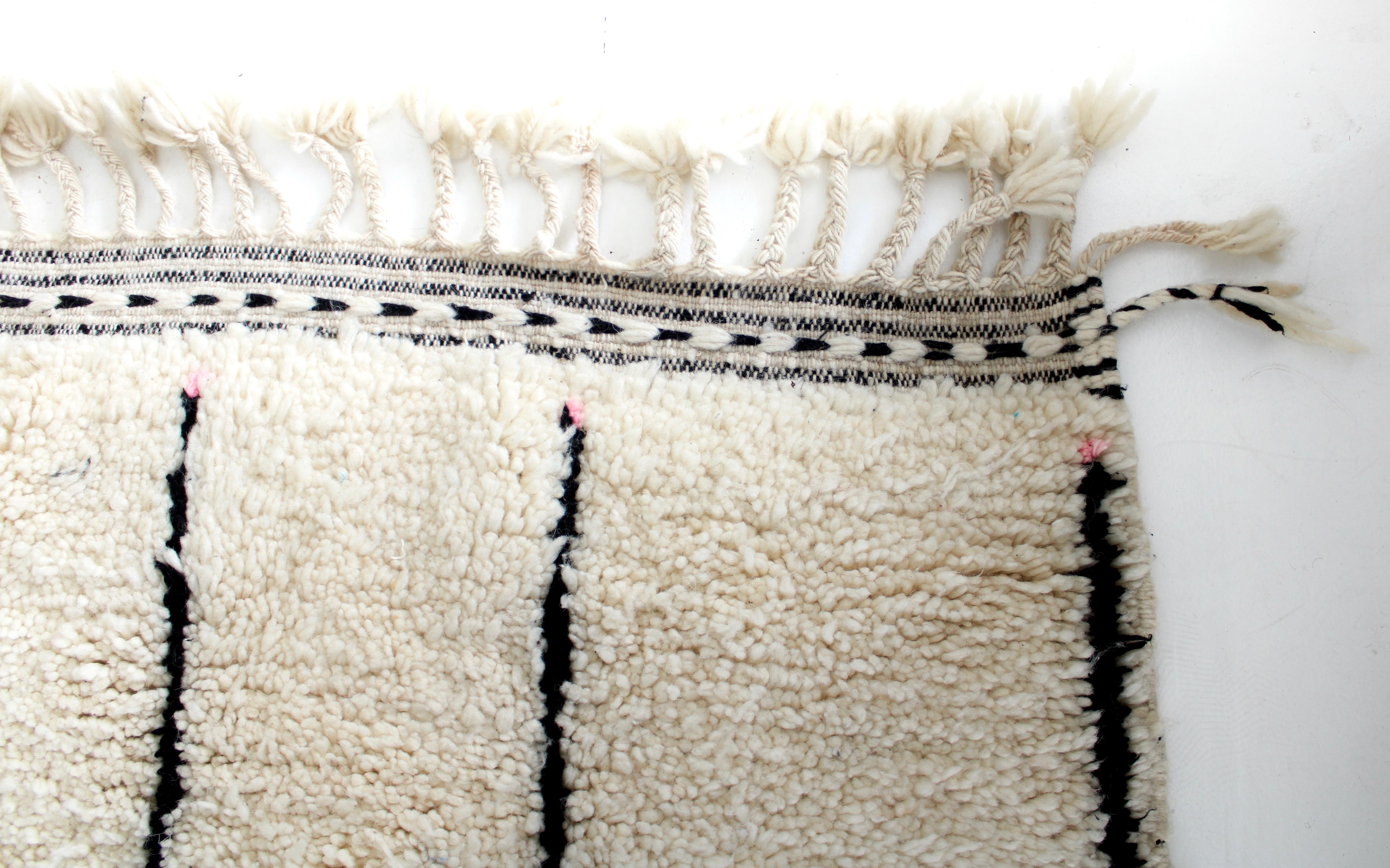 cream and black moroccan rug