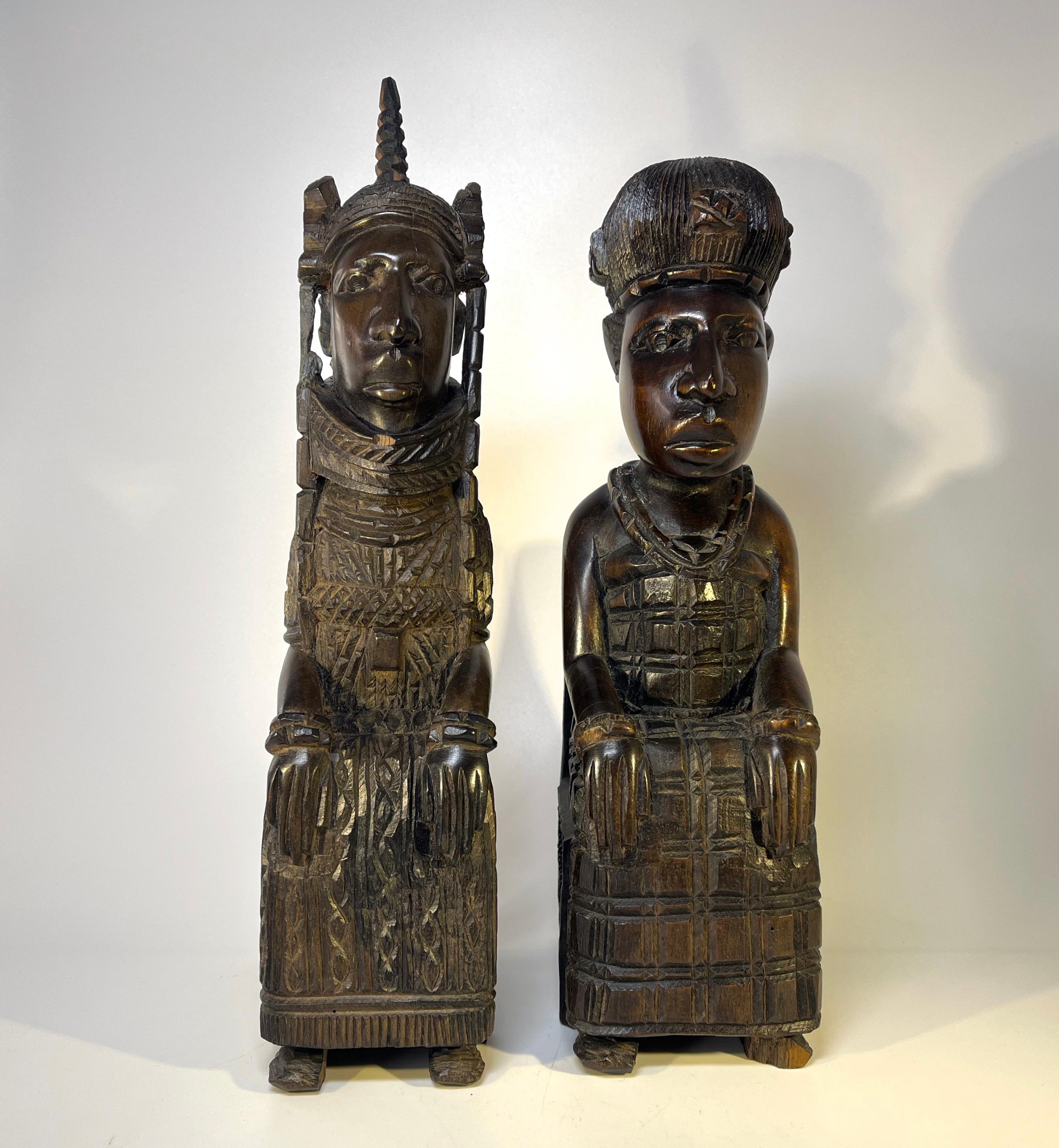 Charming Benin King Oba and his Queen. Terrific pair of Benin hand carved ebony hardwood figures.
Intricate detailing on each of these super West African carvings 
Circa Mid 20th century
King Height 11.75 inch, Width 2.5 inch, Depth 4 inch
Queen