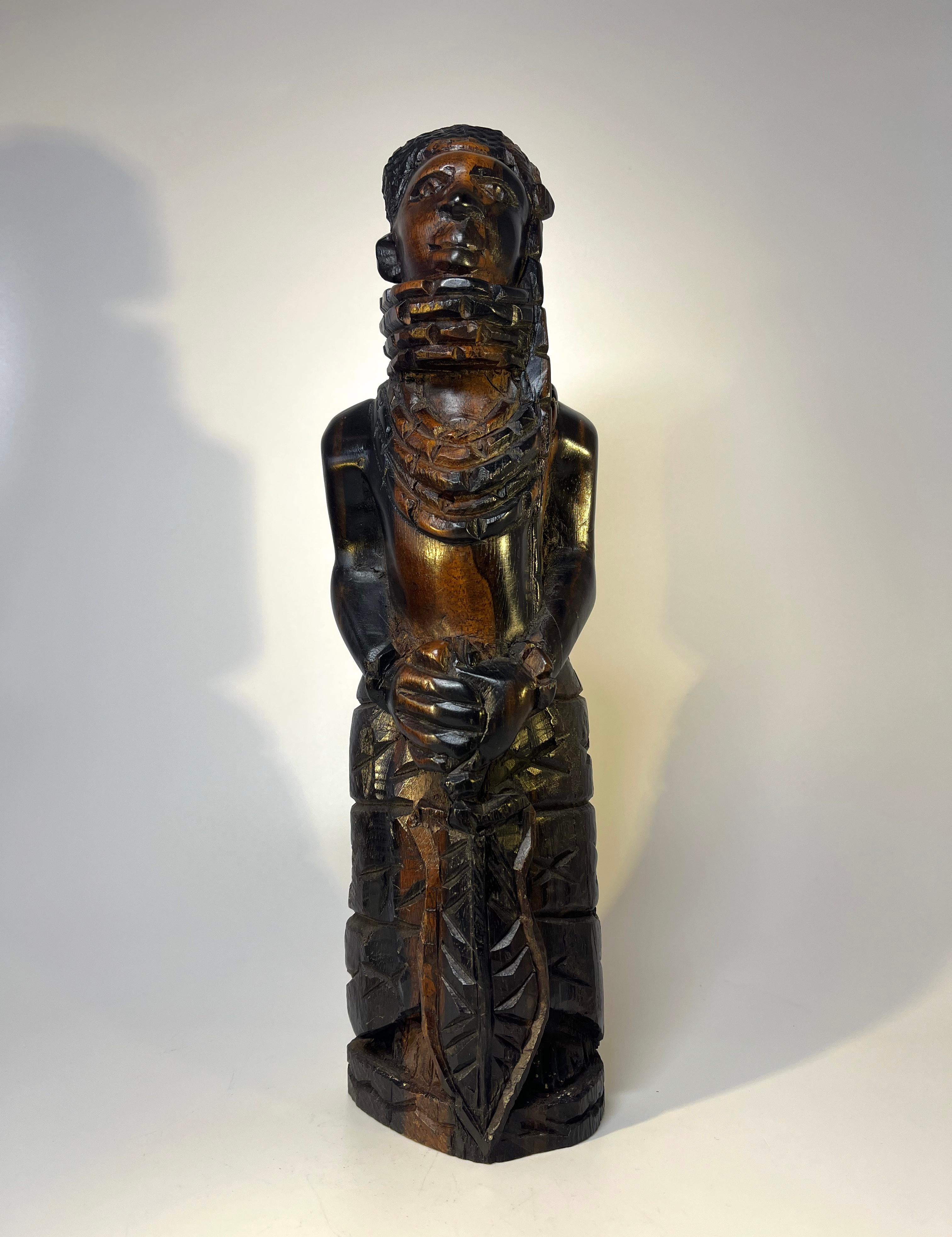 Wonderful hand carved ebony hardwood figure of a young Benin man, possibly a
future King Oba
Excellent traditional Benin artistic carving
A delightful piece
Circa 1970
Height 13 inch, Width 3.5 inch, Depth 2.5 inch
Very good condition.