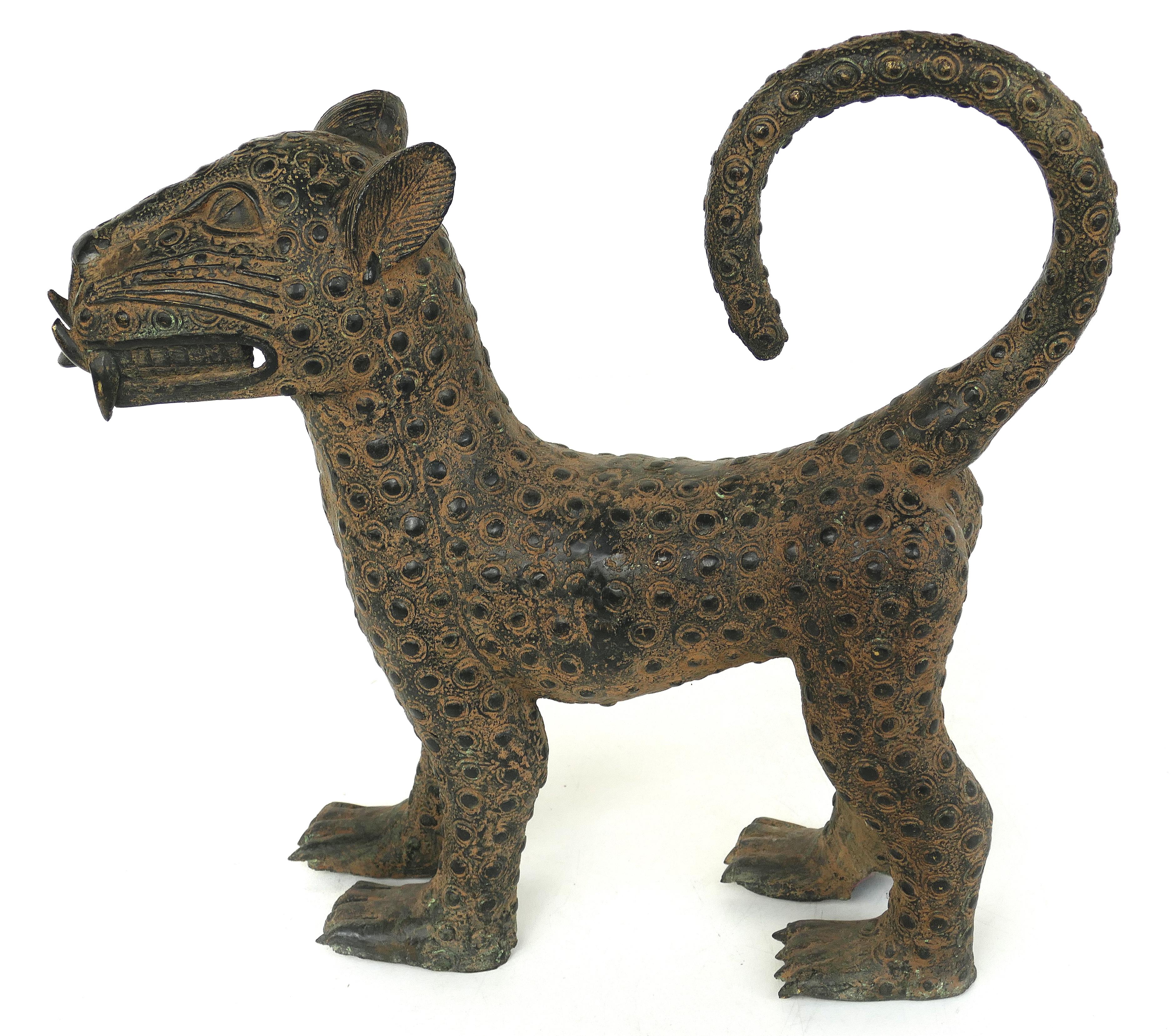 Smaller Benin 'Nigeria' bronze sculptures of Leopards, Modern Replicas

Offered for sale is a pair of modern 20th century copies of Benin (modern-day Nigeria) bronze figural sculptures of young leopards. This impressive pair of leopards make a