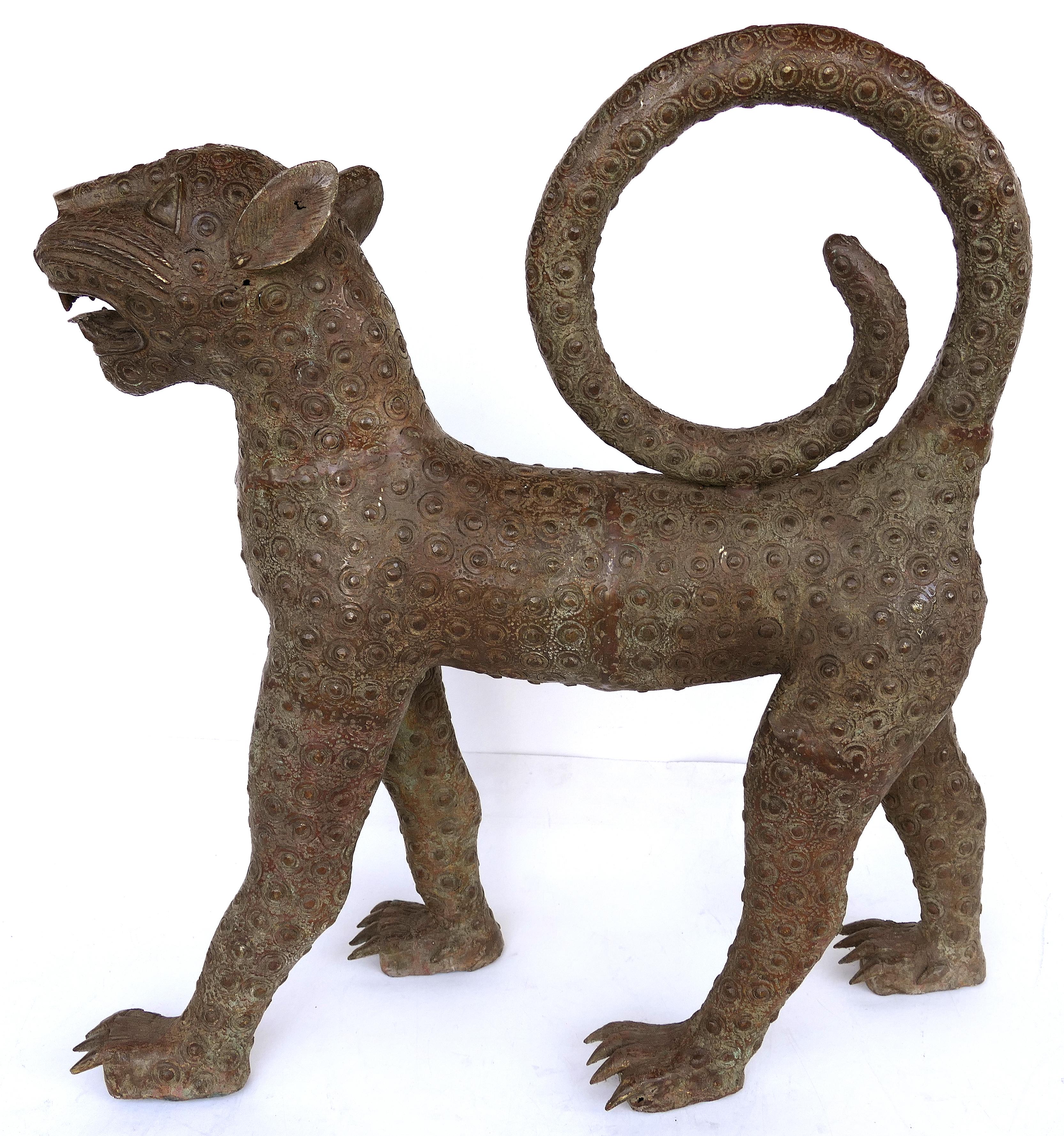 Benin (Nigeria) bronze sculptures of leopards from the mid-20th century

Offered for sale is a pair of modern mid-20th century copies of Benin (modern-day Nigeria) bronze figural sculptures of leopards. This large and impressive pair of leopards