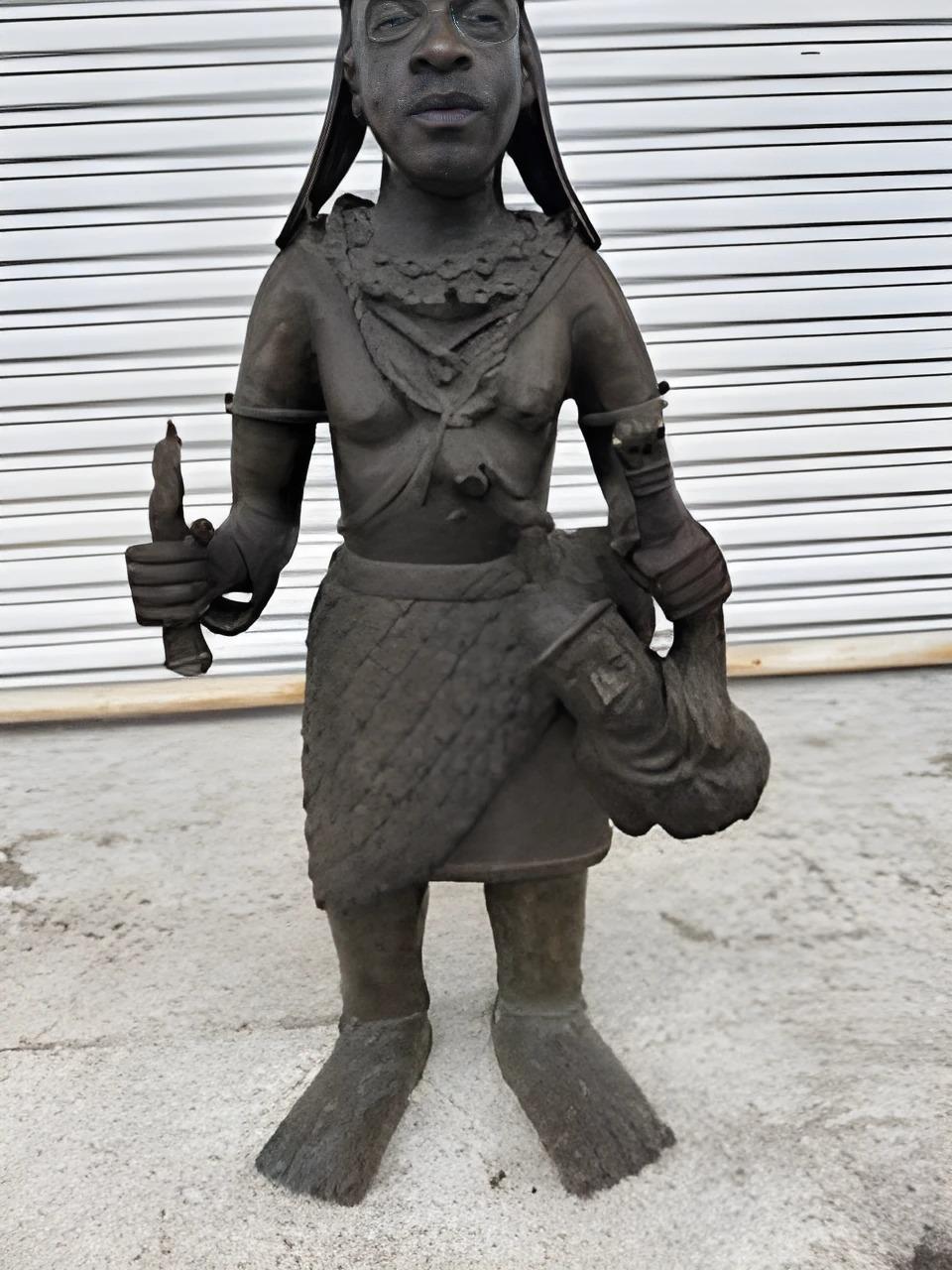 Bronze Benin Sculpture of an Oba Warrior.
L-14 1/2
W - 9
H-35