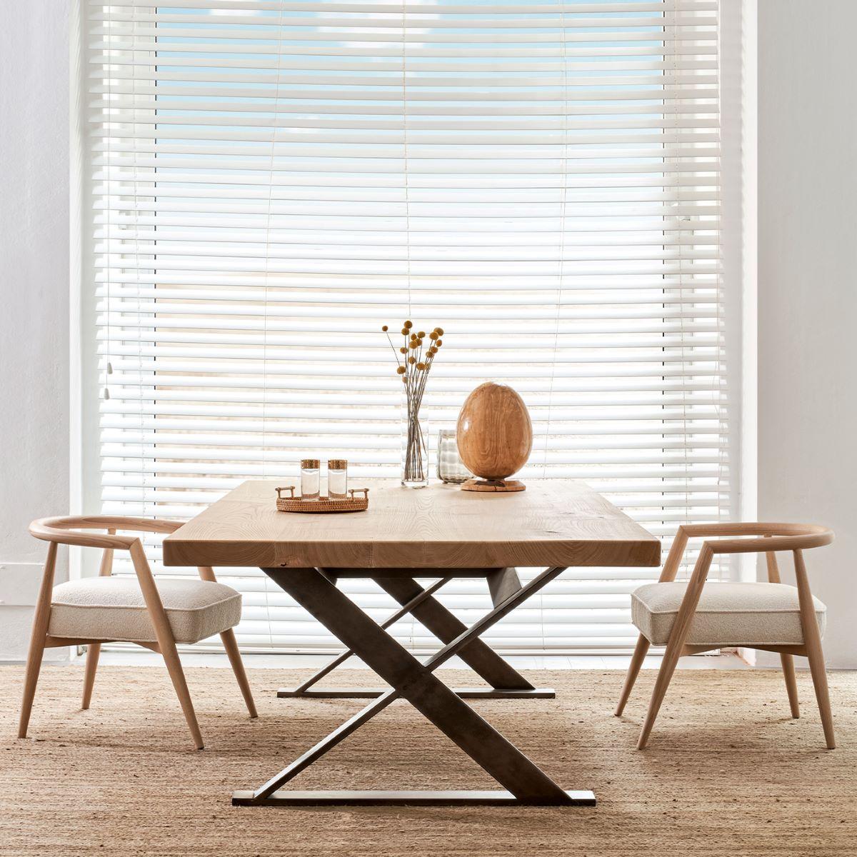 Reminiscent of a picnic table with X-shaped legs, this gorgeous dining table will make an original statement in a contemporary or rustic-chic interior space. Resting on a gray-lacquered structure, it features a large rectangular wooden top.