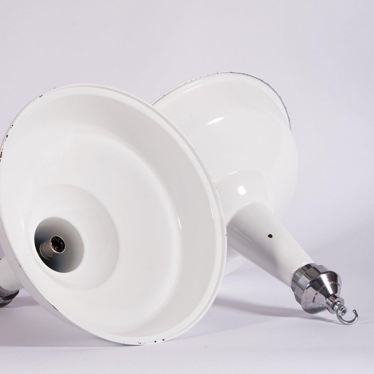 Having sources hundreds of Benjamin Electric industrial lights, we have never come across a lamp of this size and specification.

Reclaimed from a hospital plant room in central London these XL white vitreous enamel pendants are the best we have