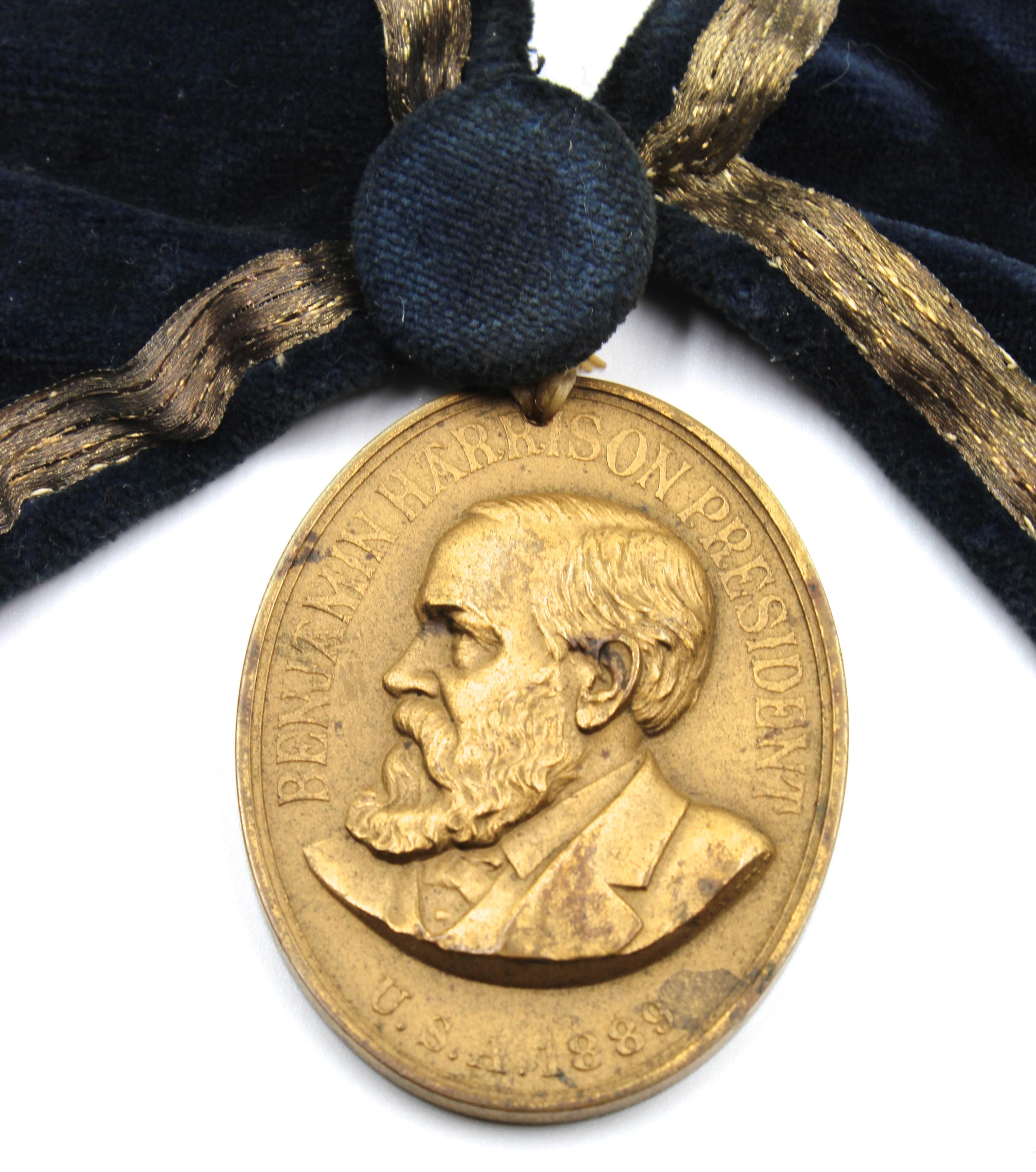 Presented is an original Benjamin Harrison presidential peace medal. This bronze medal was originally struck by the U.S. Mint in 1889 as a peace offering to the various Native American tribes in the U.S. The obverse of the medal has a raised relief