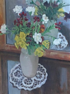 Flowers in vase with doily