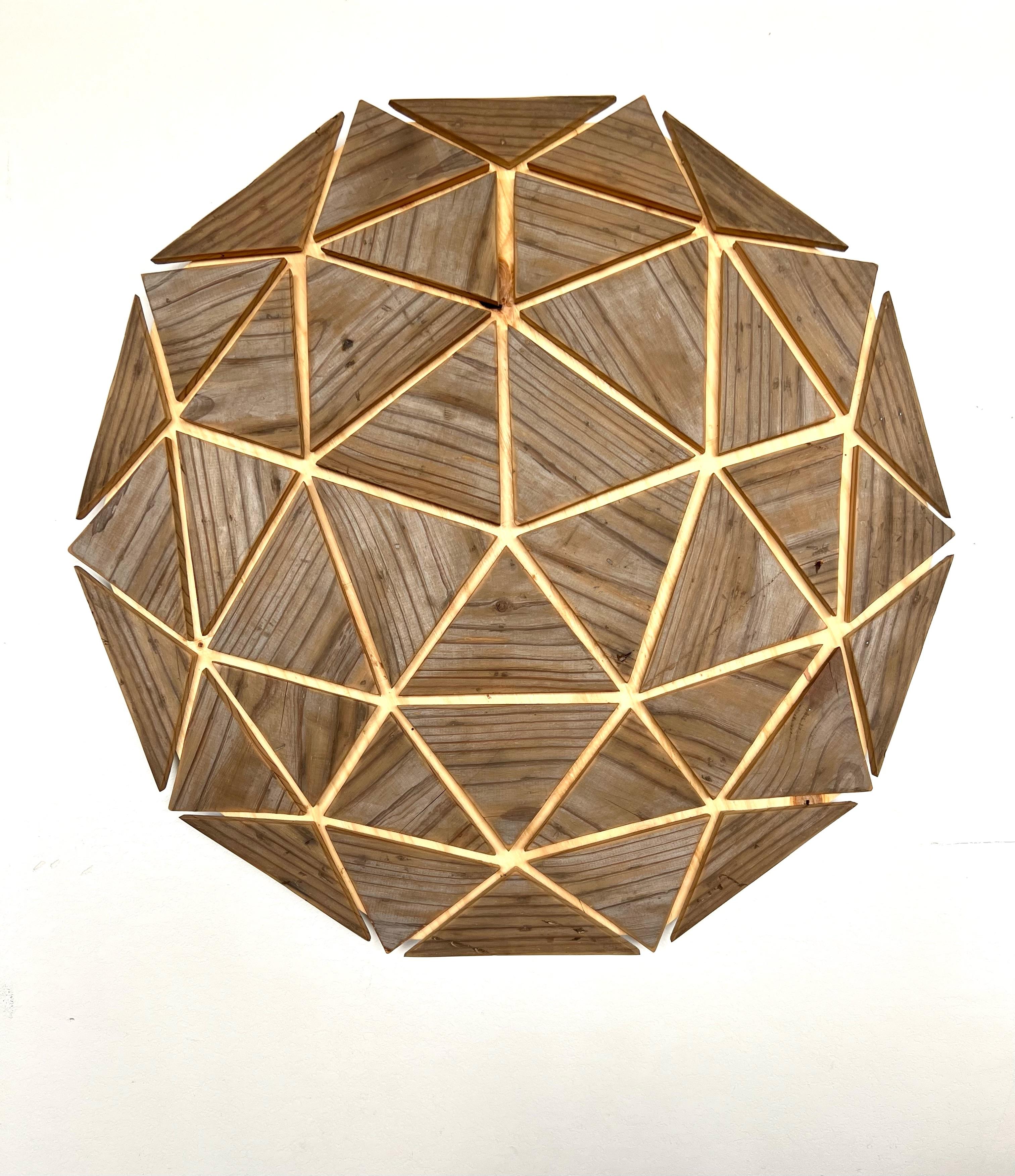 Benjamin Lowder’s artwork reconstitutes aged wood and vintage signs, embracing sacred geometry to build new crystalline patterns and structures. Inspired by architecture and semiotics, Lowder showcases the history of his aged materials to construct