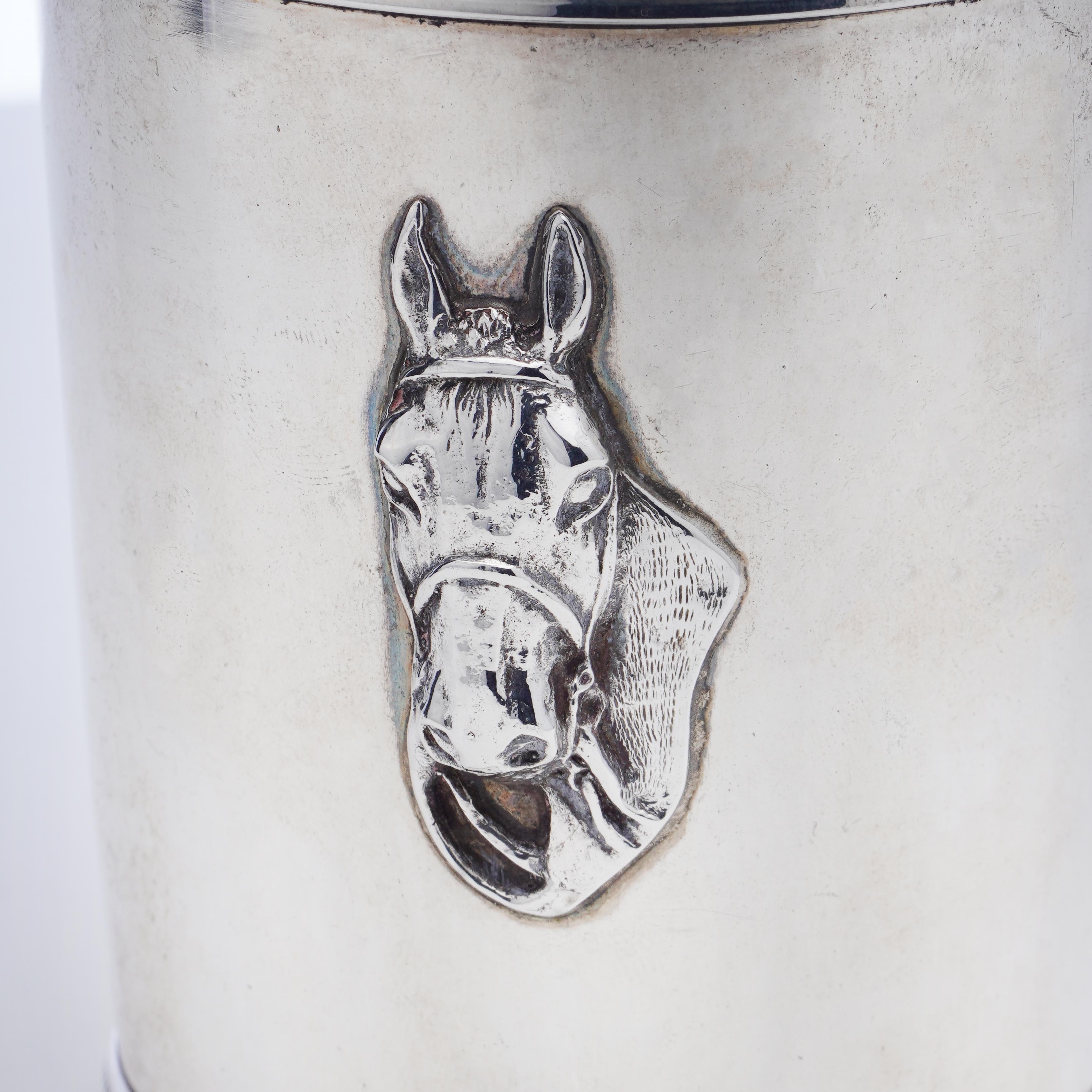 Vintage sterling silver mint julep cup beaker with embossed horse's head decoration, monogram, and engravings on the base. 
Made in the U.S., Ca. 1950s 
Maker: Benjamin Trees
Fully hallmarked.
The base has an engraving '' When you have a drink