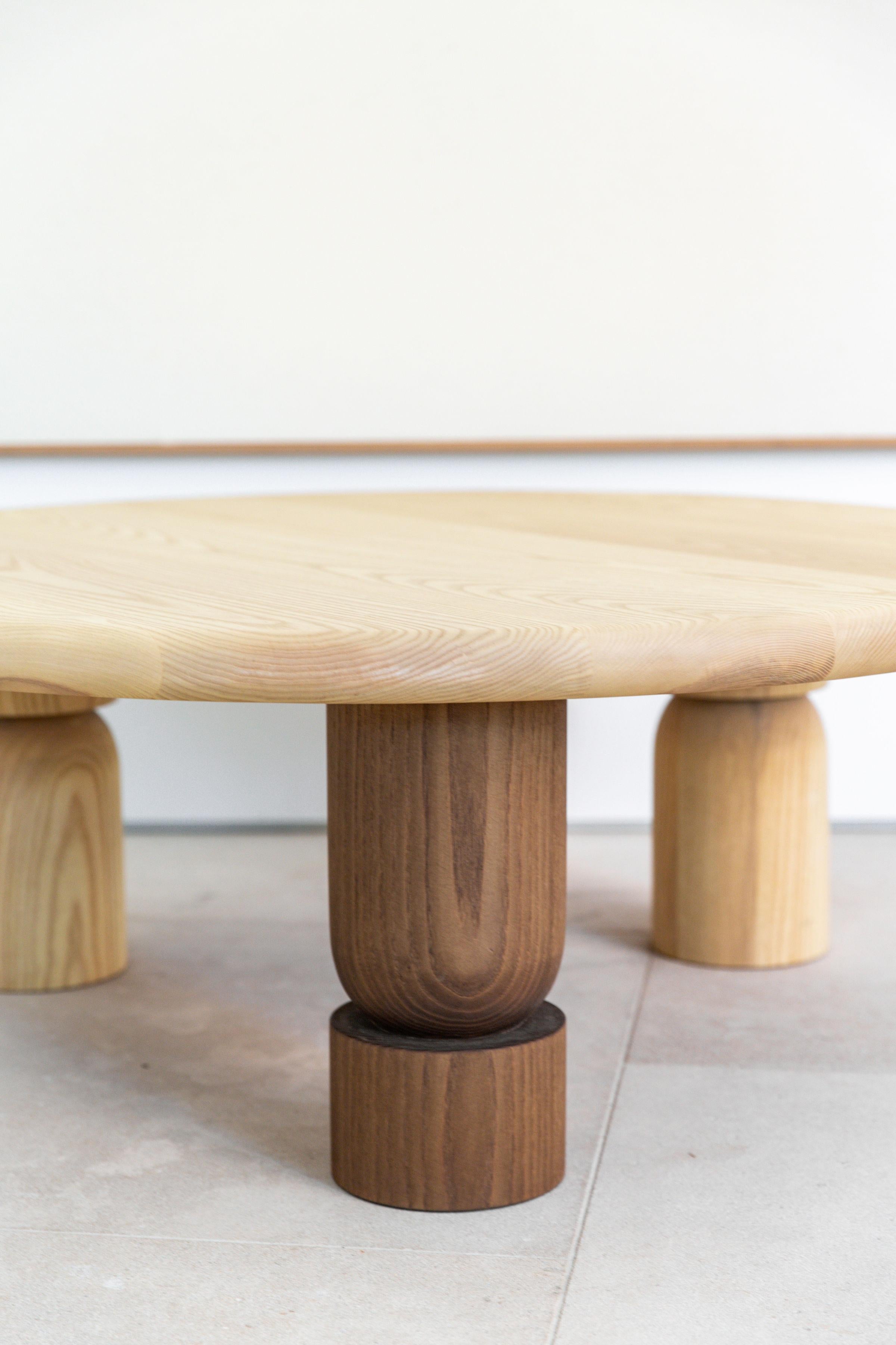Part of the Michael Kussman/Natalie Myers collaboration Canyon Collection. Our capsule collection includes The Benmore table. A low coffee table with a fully rounded edge profile and three thick hand turned legs. One of the three legs is a wildcard.