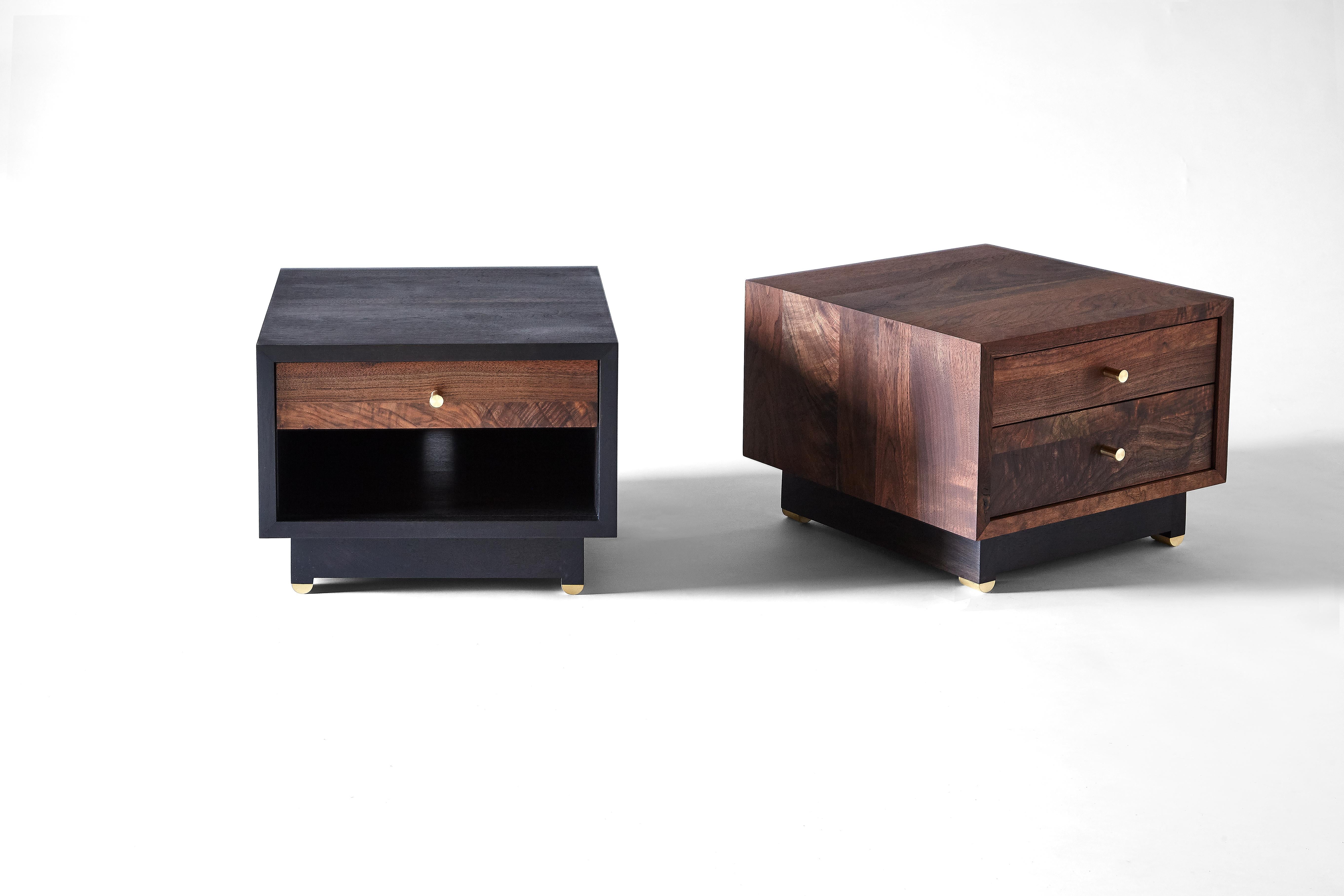The Bena side cabinet is a bedside cabinet or side table that features natural or blackened brass pulls and feet. It is available in Claro walnut, black walnut (natural, oxidized or ebonized), maple (bleached or oxidized), cherry, ebonized ash and