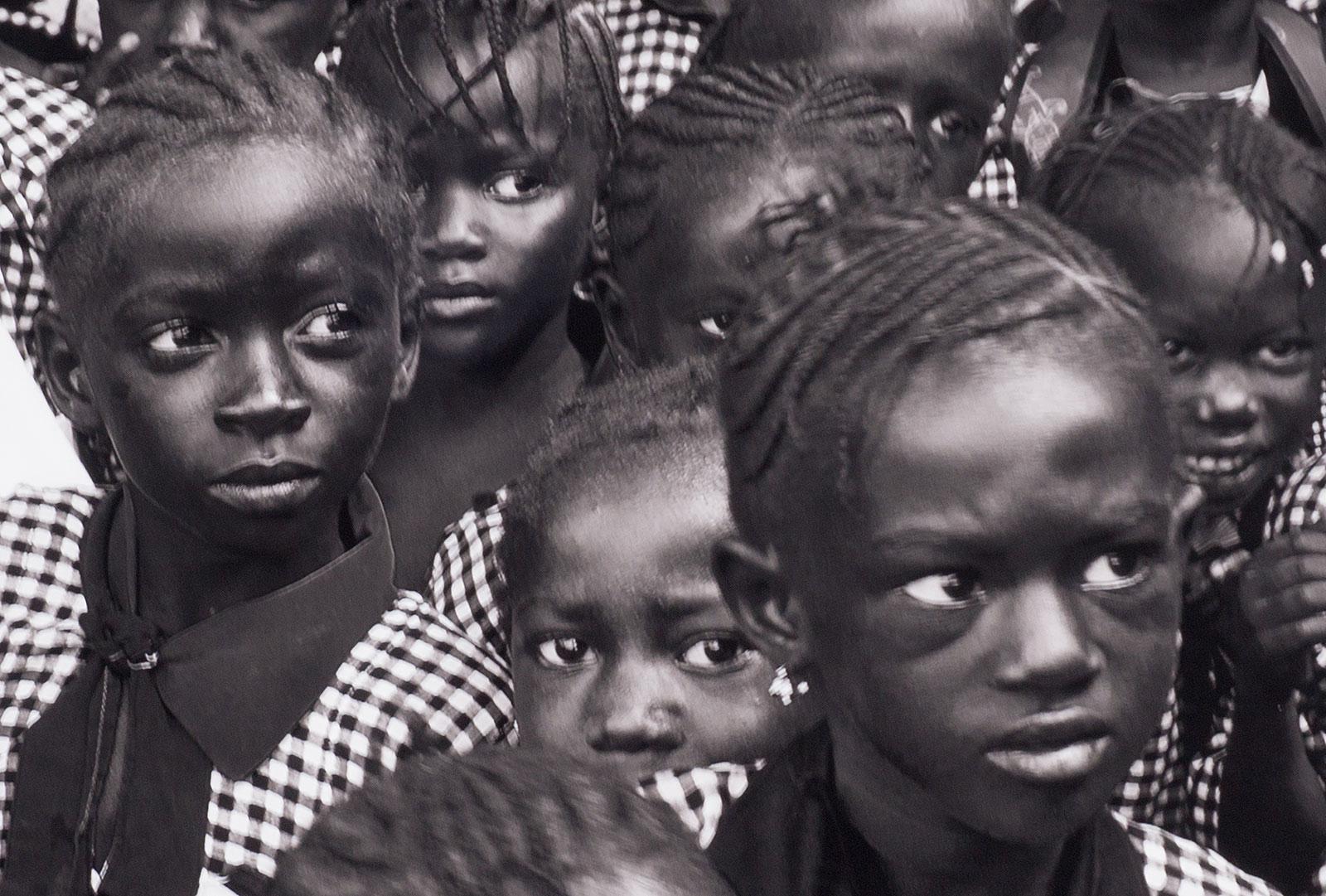 Black and White (School children in Gambia, West Africa) - Photograph by Benno Thoma