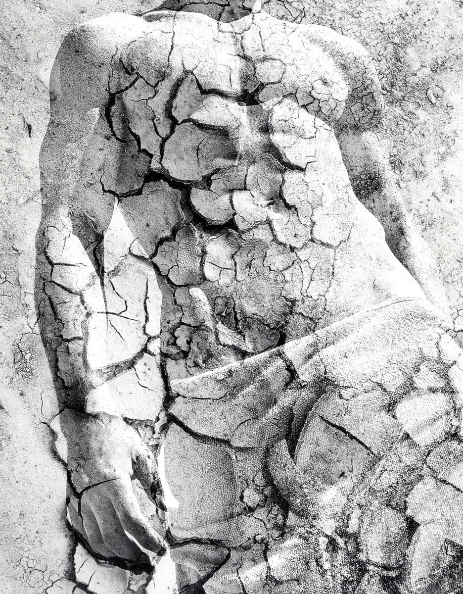 Dry Earth Sculpture (young nude male photo superimposed on cracked earth photo) - Contemporary Photograph by Benno Thoma