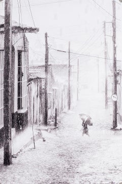 Lady in the Rain (a lone Cuban woman and her umbrella battle the weather Gods)