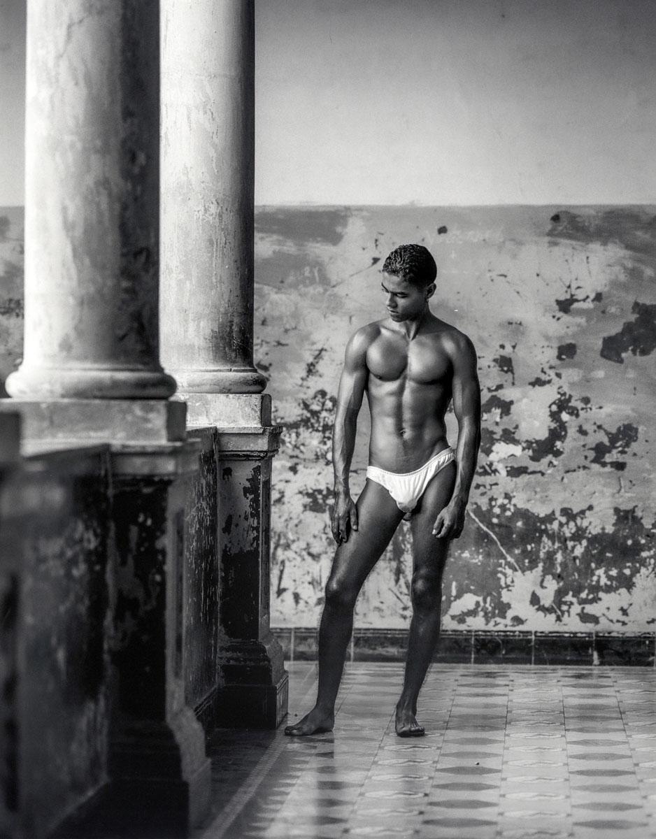 Benno Thoma Figurative Photograph - Leonel, Cuba (Cuban man's youthful body contrast with ancient architecture)