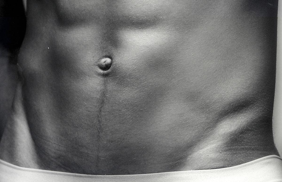 Mohamed (Magnificent sculpted abs of a young Czech maleI - Black Nude Photograph by Benno Thoma
