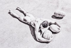 Rocks (nude model from Bel Ami lies prone with rocks in Greece)