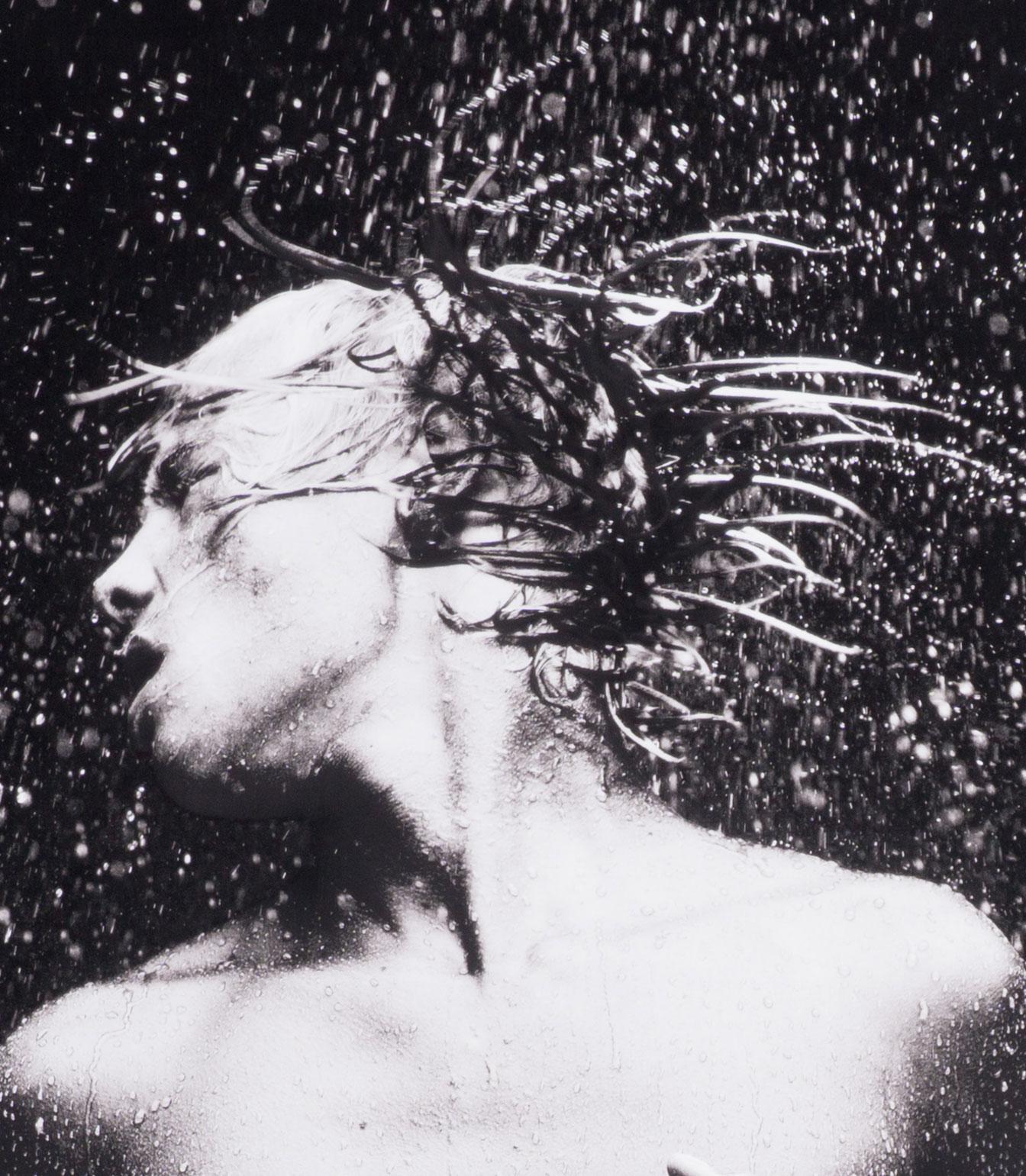 WET 13 (nude Dutch boy sends beads of water flying from his long mane of hair)   - Photograph by Benno Thoma
