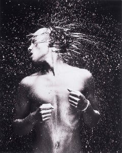 WET 13 (nude Dutch boy sends beads of water flying from his long mane of hair)  