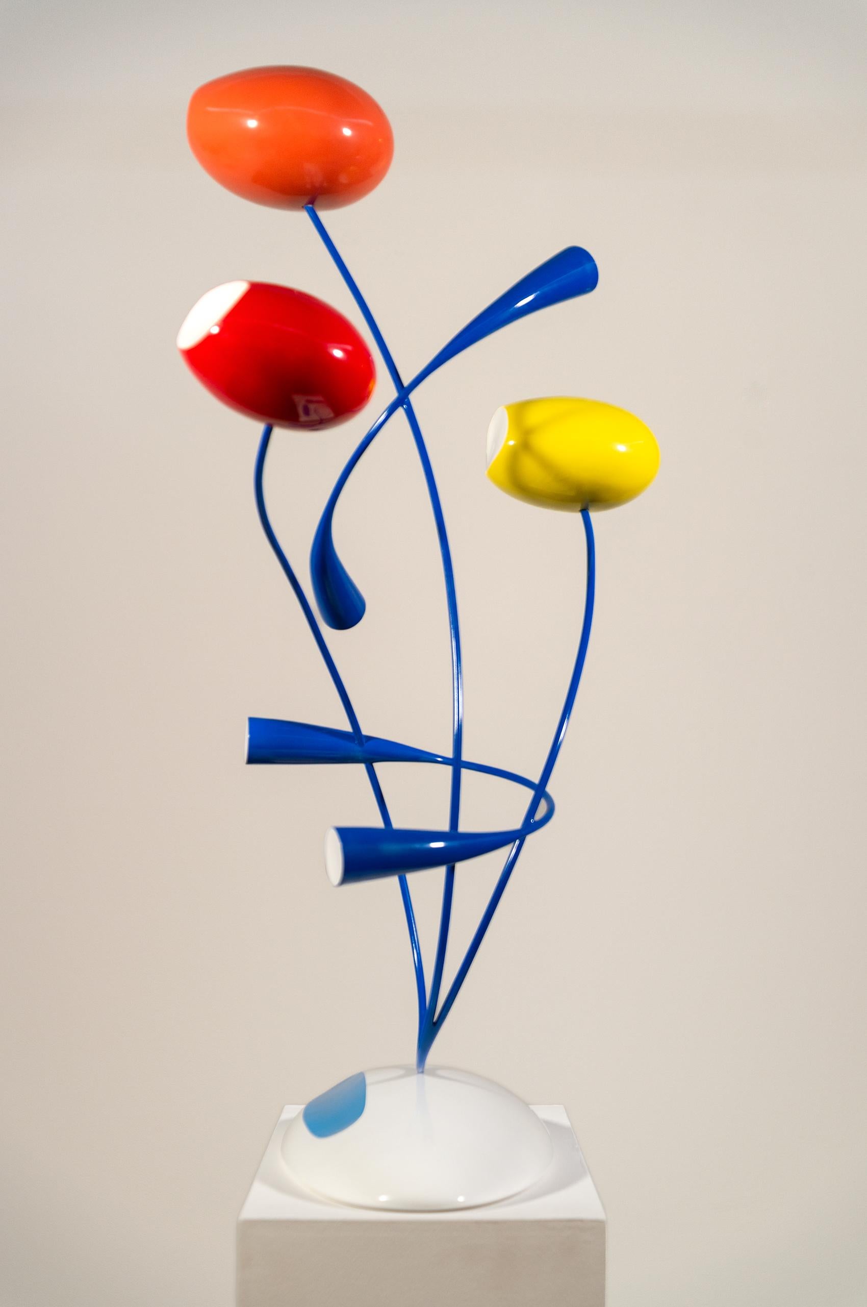 Funky and fun, this glossy, brightly coloured sculpture by Benny Katz is a contemporary ‘take’ on a bouquet of flowers. To create his ‘flower series’ the Israel-based artist has used minimalist oval and elongated shapes in orange, yellow, white and