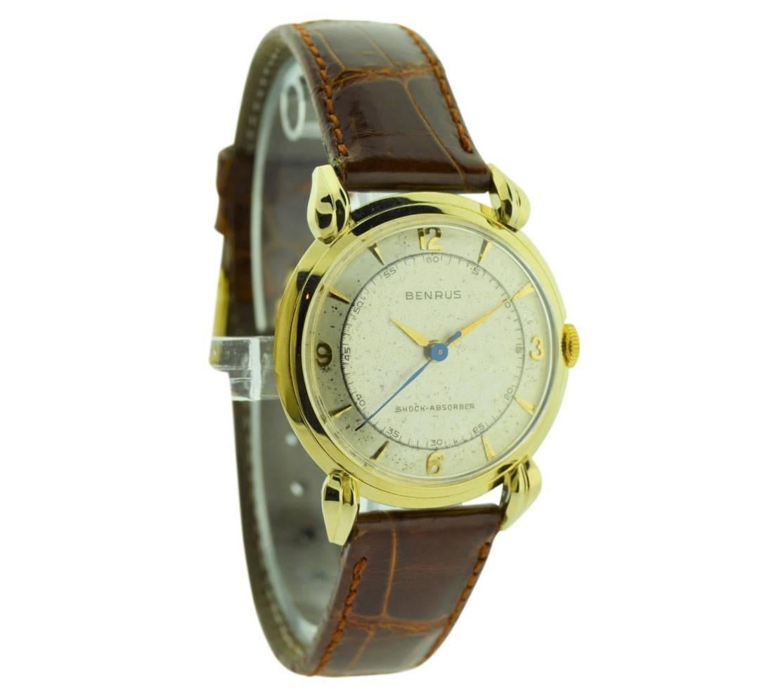 FACTORY / HOUSE: Benrus Watch Company
STYLE / REFERENCE: Art Deco Style
METAL / MATERIAL: 14kt. Solid Gold
CIRCA:  1950's
DIMENSIONS: 27mm X 32mm
MOVEMENT / CALIBER: Winding / 17 Jewels 
DIAL / HANDS: Original Patinated Pie Pan Dial / Dauphine
