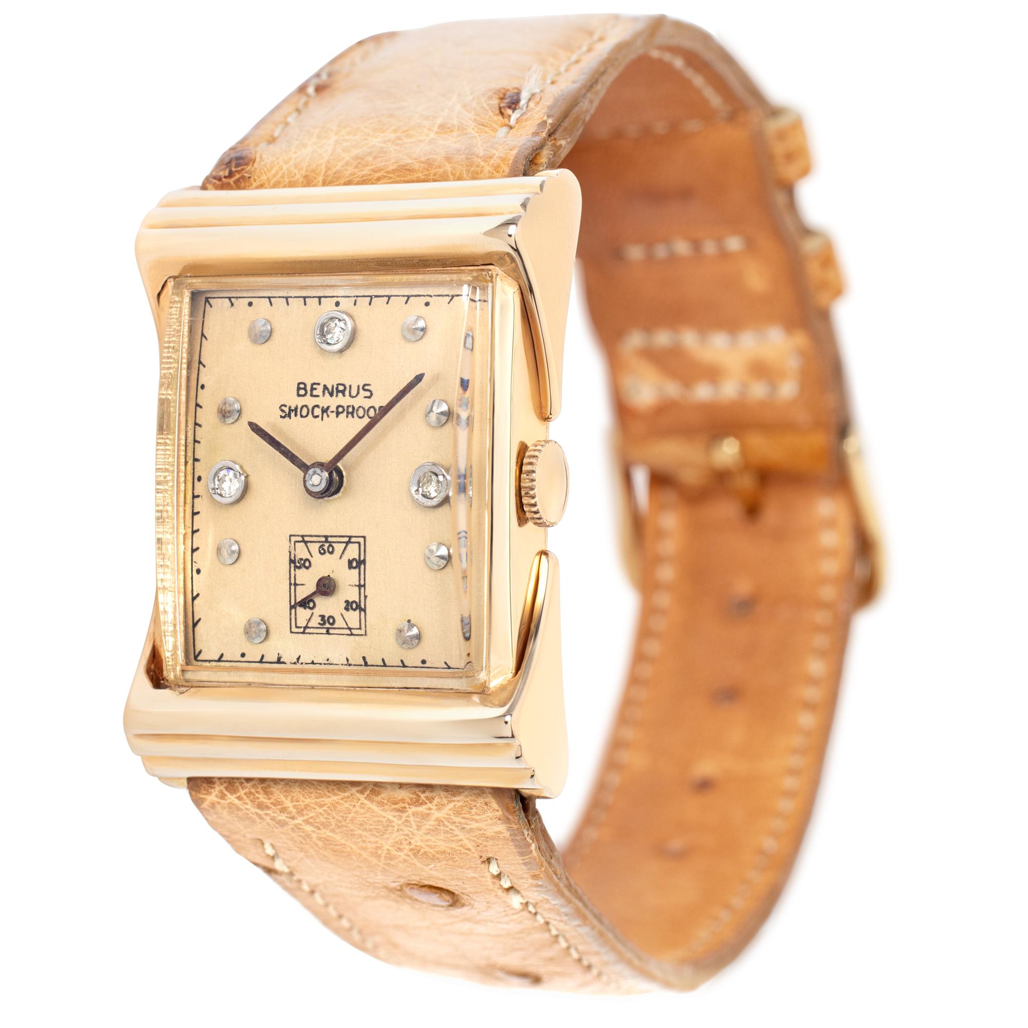 Vintage unisex Benrus Shock-proof  14k yellow gold case, 14k yellow gold  bezel, ostrich leather strap with gold filled tang buckle. Case size 32mm x 22mm. Manual wind. Fine Pre-owned Benrus Watch. Certified preowned Vintage Benrus Classic watch is