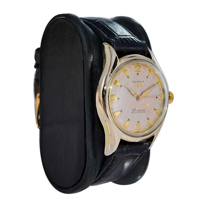 FACTORY / HOUSE: Benrus Watch Company
STYLE / REFERENCE: Round
METAL / MATERIAL: Gold Filled
CIRCA / YEAR: 1950's
DIMENSIONS / SIZE: Length 42mm X Diameter 32mm 
MOVEMENT / CALIBER: Automatic Winding / 17 Jewels 
DIAL / HANDS: Original Patinated and